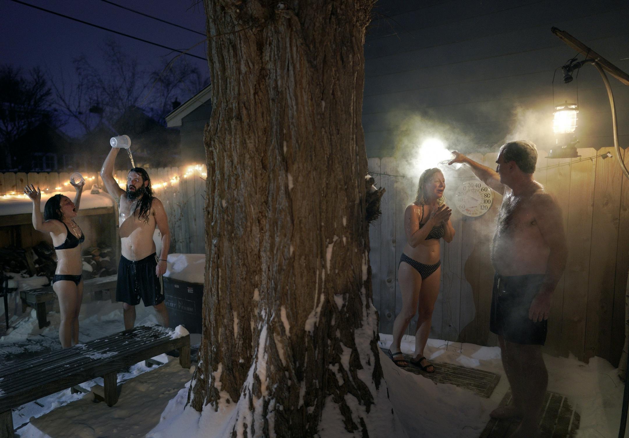As temperatures dipped into the minus 20 degree range with a -42 windchill, Glenn and Julia Auerbach (right) invited their friends Dan Wilson and Omina Shibahara (left) over to their south Minneapolis home for a backyard sauna. The hot room was 200 degrees and the air temp was 220 degrees colder at minus 20.