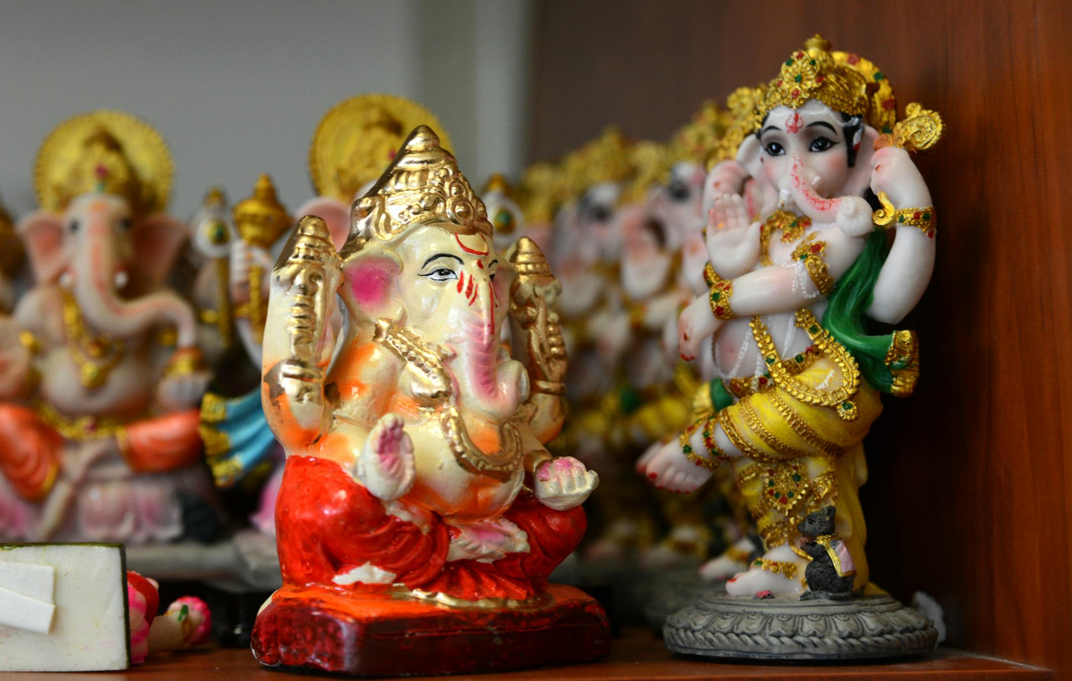Images of Ganesh line the shelves at Pooja Grocers. Ganesh is a elephant-headed Hindu god of wisdom and problem solving who is the son of Shiva and Parvati and is represented as a pot-bellied man with an elephant's head ] Ethnic restaurants and grocery stores line Central Avenue in Columbia Heights, drawing community members and commuters alike to sample different cultures' cuisines. Richard.Sennott@startribune.com Richard Sennott/Star Tribune Columbia Heights , Minn. Tuesday 3/11/2014) ** (cq)