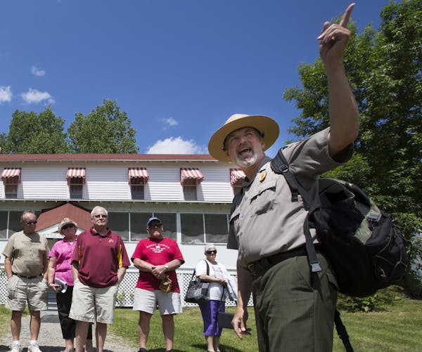 Kevin Nelson, right, an interpretive park ranger, leads a tour group at the Kettle Falls Hotel. ] (Leila Navidi/Star Tribune) leila.navidi@startribune