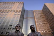 A bronze statue of Dr. William J. Mayo and Dr Charles H. Mayo titles "My Brother and I" outside the Mayo Clinic in Rochester, Minn. The brothers along