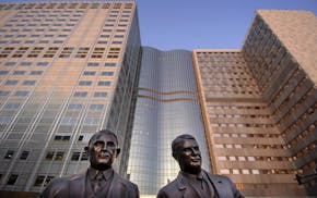 A bronze statue of Dr. William J. Mayo and Dr Charles H. Mayo titles "My Brother and I" outside the Mayo Clinic in Rochester, Minn. The brothers along