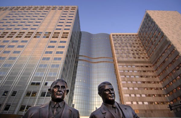 A bronze statue of Dr. William J. Mayo and Dr Charles H. Mayo titles "My Brother and I" outside the Mayo Clinic in Rochester, Minn. The brothers along