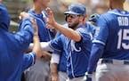 Mike Moustakas, center, leads a potent Royals attack.