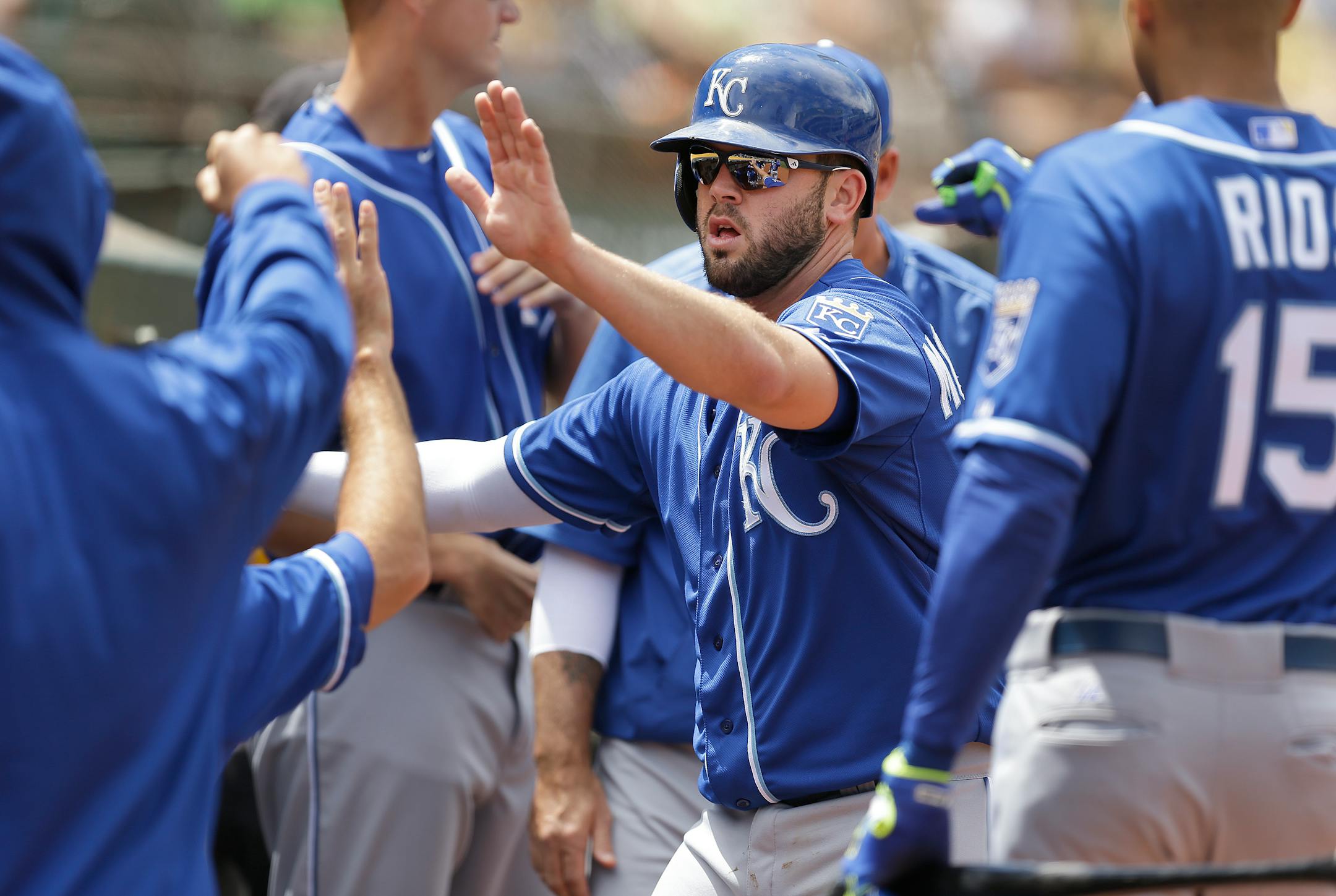 Mike Moustakas, center, leads a potent Royals attack.