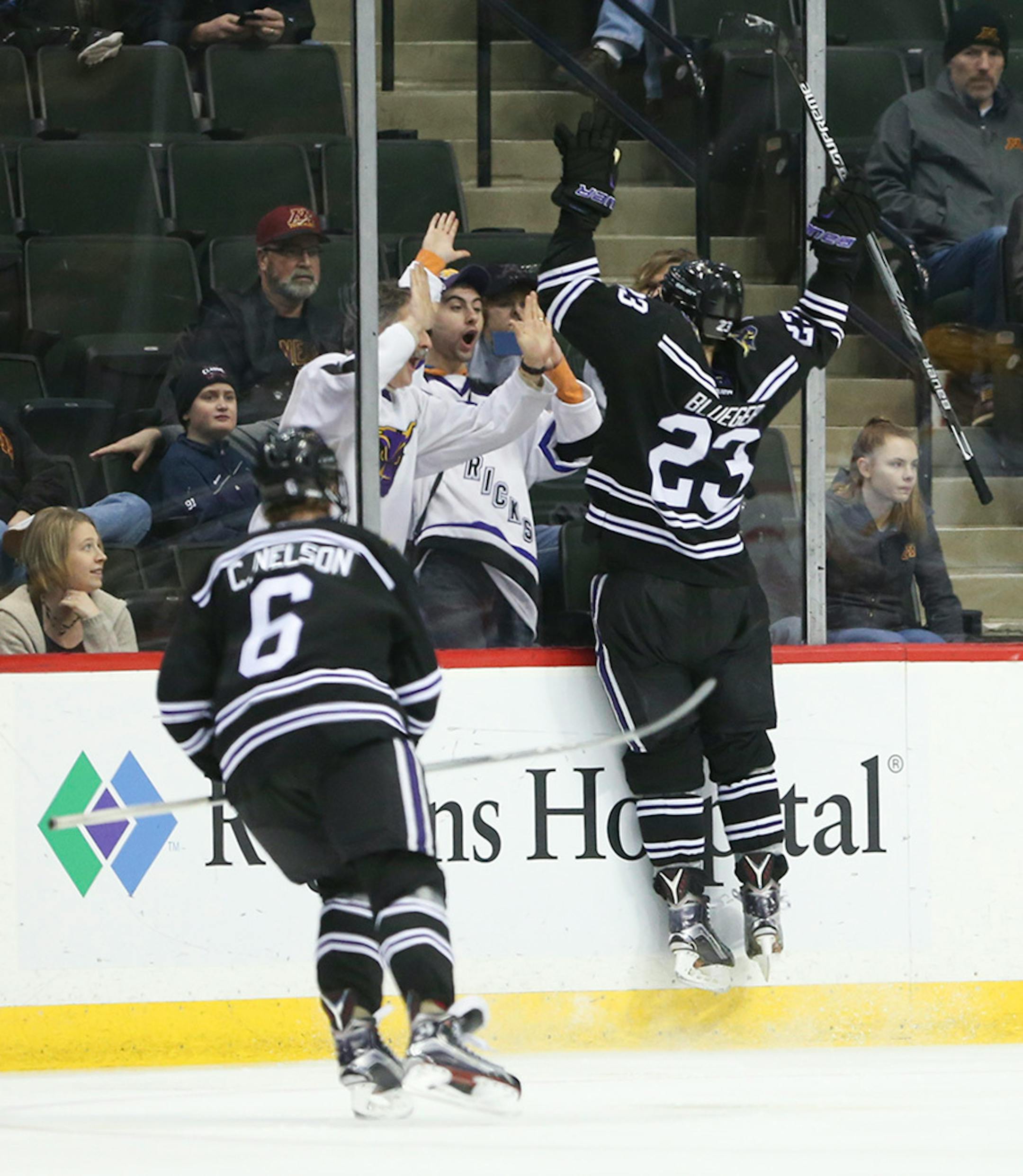 Mavericks forward Teddy Blueger (23) celebrated his game-winning goal with some Mankato fans in the third period Sunday afternoon.