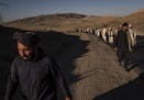 FILE-- Members of a peace march walking to Wardak, Afghanistan, from Ghazni, June 12, 2018. Afghanistan&#x2019;s quixotic band of peace marchers invad