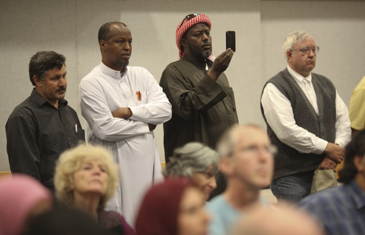 Citizens stood along a wall Tuesday night as the St. Anthony City Council took up the issue of a proposed 15,000-square-foot Islamic center on Old Hwy. 8.