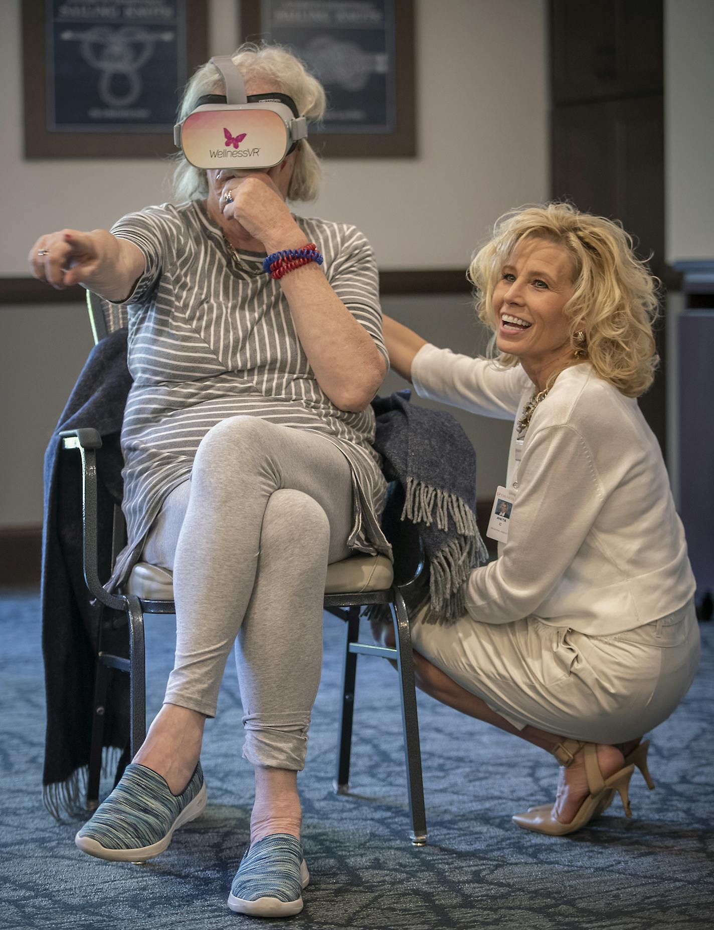 Shorewood Landing memory-care resident Kathy Boone described what it was like to be in Montana through a virtual reality system to Regional Director of Operations Anita Cornelius, Tuesday, July 23, 2019 in Excelsior, MN. Shorewood Landing, an assisted-living facility, is introducing the use of virtual reality in a group setting. Through a virtual reality system, they can explore virtual worlds (farms, Lake Superior, onstage at the opera, etc.) together and then talk about it like a book club. Th