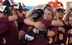 Gophers pitcher Amber Fiser (13) got hugs from her coaches and teammates after getting the win. ] ANTHONY SOUFFLE &#x2022; anthony.souffle@startribune