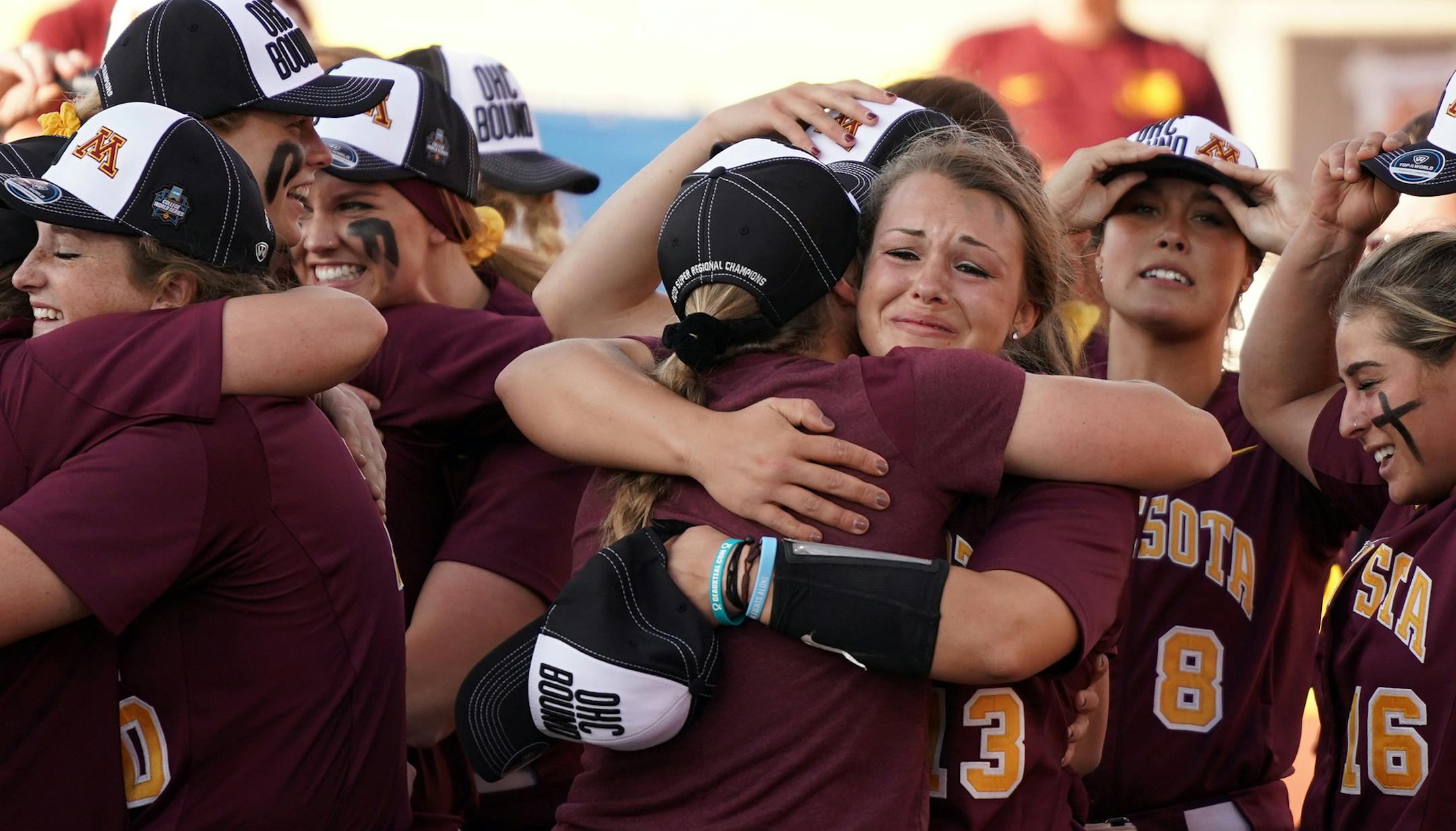 Gophers pitcher Amber Fiser (13) got hugs from her coaches and teammates after getting the win. ] ANTHONY SOUFFLE • anthony.souffle@startribune.com The Gophers played the LSU Tigers in an NCAA super regional softball game Saturday, May 25, 2019 at Jane Sage Cowles Stadium in Minneapolis.