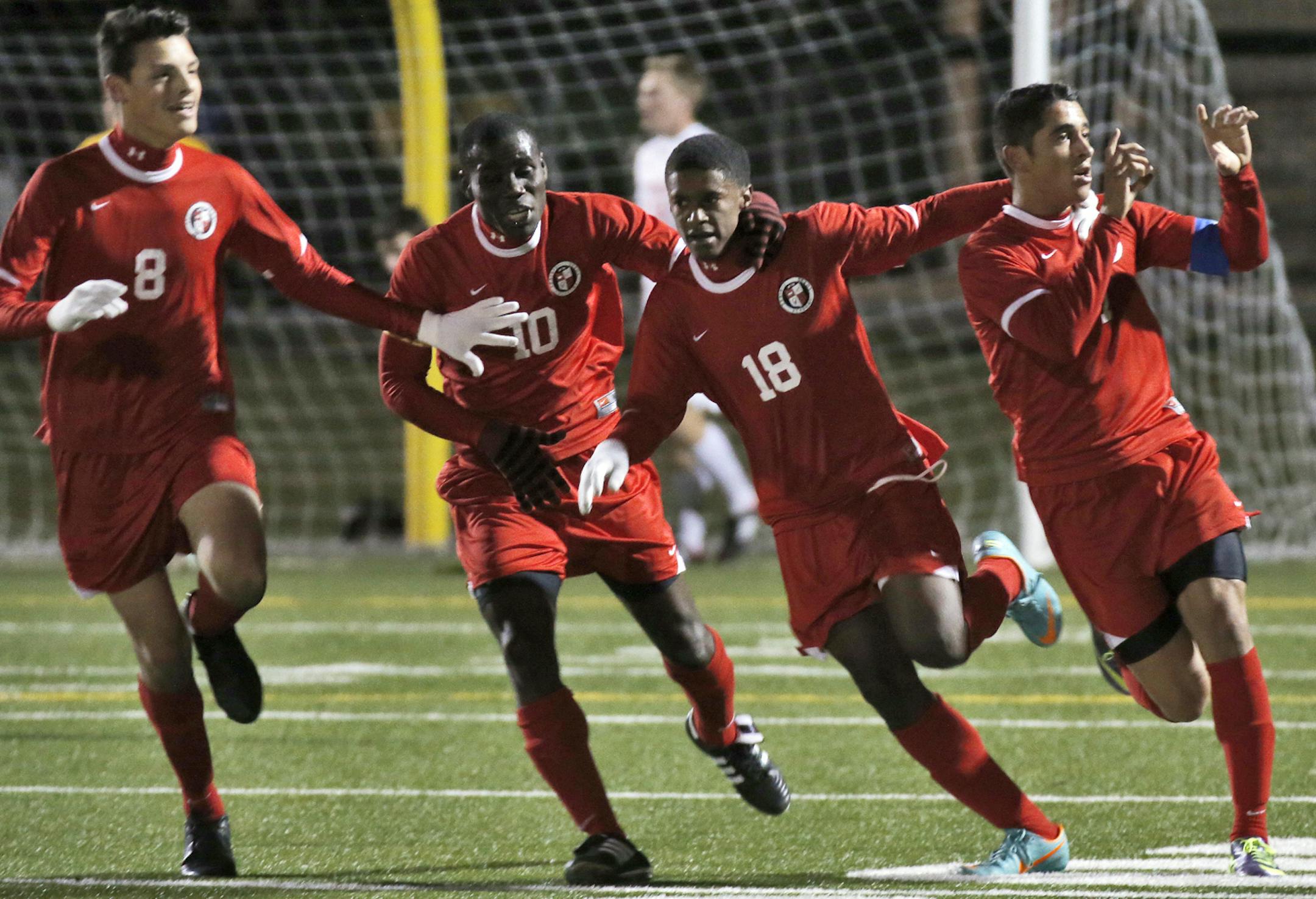Boys soccer quarterfinals. North St. Paul Polars vs. Prairie Seeds Academy Lycans. Lycans Mounir Peterson-Darbaki, right, celebrated with teammates after he scored a goal in first period action. (MARLIN LEVISON/STARTRIBUNE(mlevison@startribune.com)