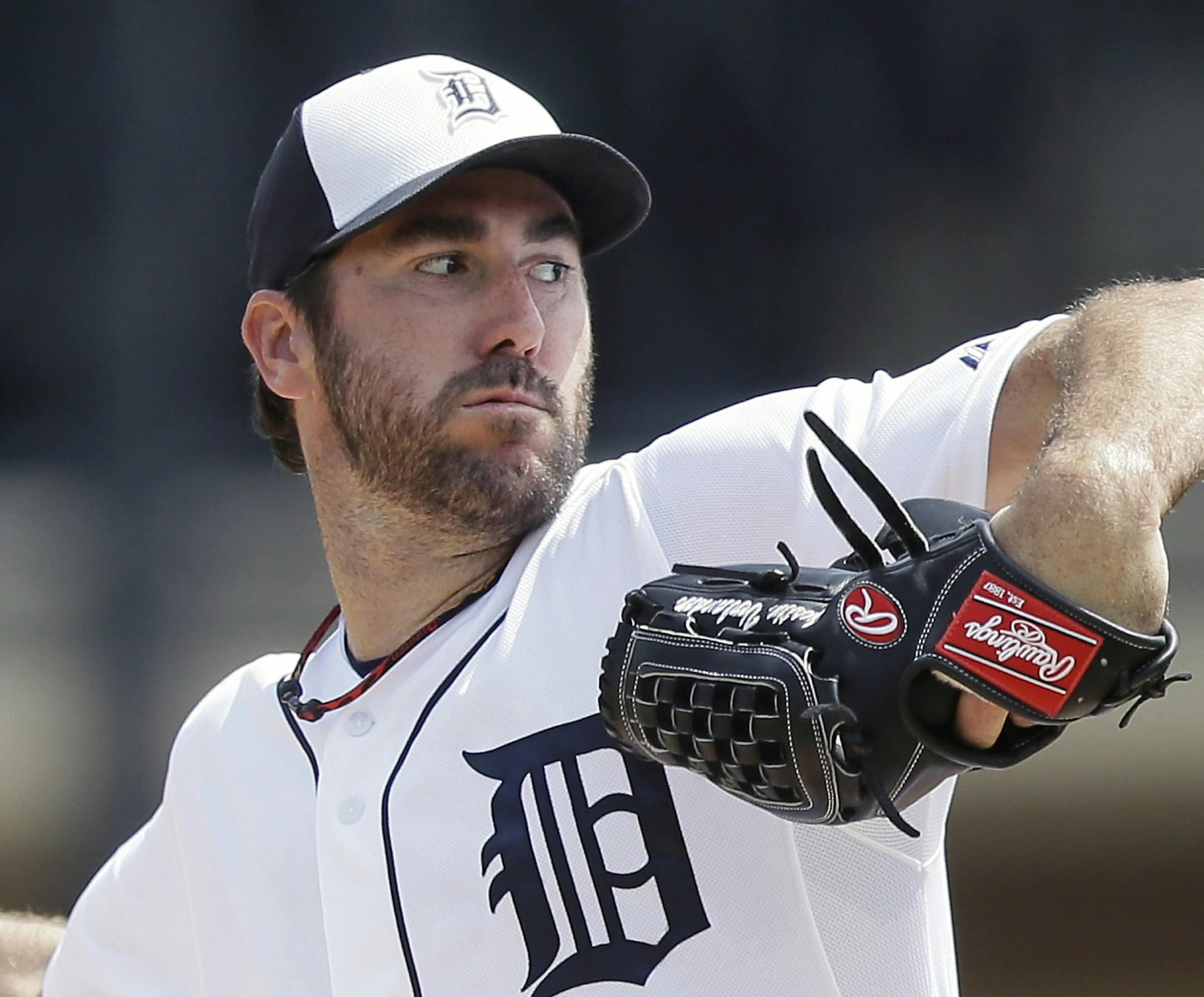 FILE - In this March 22, 2015, file photo, Detroit Tigers starting pitcher Justin Verlander throws during the second inning of a spring training exhibition baseball game against the Washington Nationals in Lakeland, Fla. Verlander is headed to the disabled list for the first time in his major league career. The Tigers said Thursday, April 2, 2015, the 32-year-old right-hander won't be on the active roster for Monday's opener against Minnesota because of tightness in his right triceps.(AP Photo/C