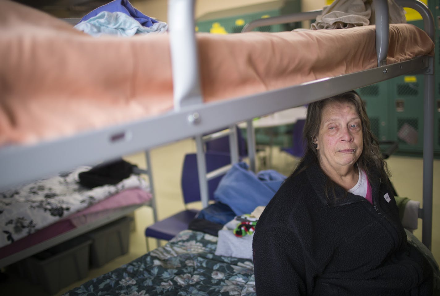 Jane Turner, 62, has been homeless for a year and a half and living at a shelter. Jane is part of a growing population of senior women who are homeless. She will be leaving Dorothy Day soon to move into an assisted living facility. She posed for a picture on her bunk bed at the Dorothy Day Center on Friday, April 24, 2015, in St. Paul, Minn. ] RENEE JONES SCHNEIDER &#x2022; reneejones@startribune.com