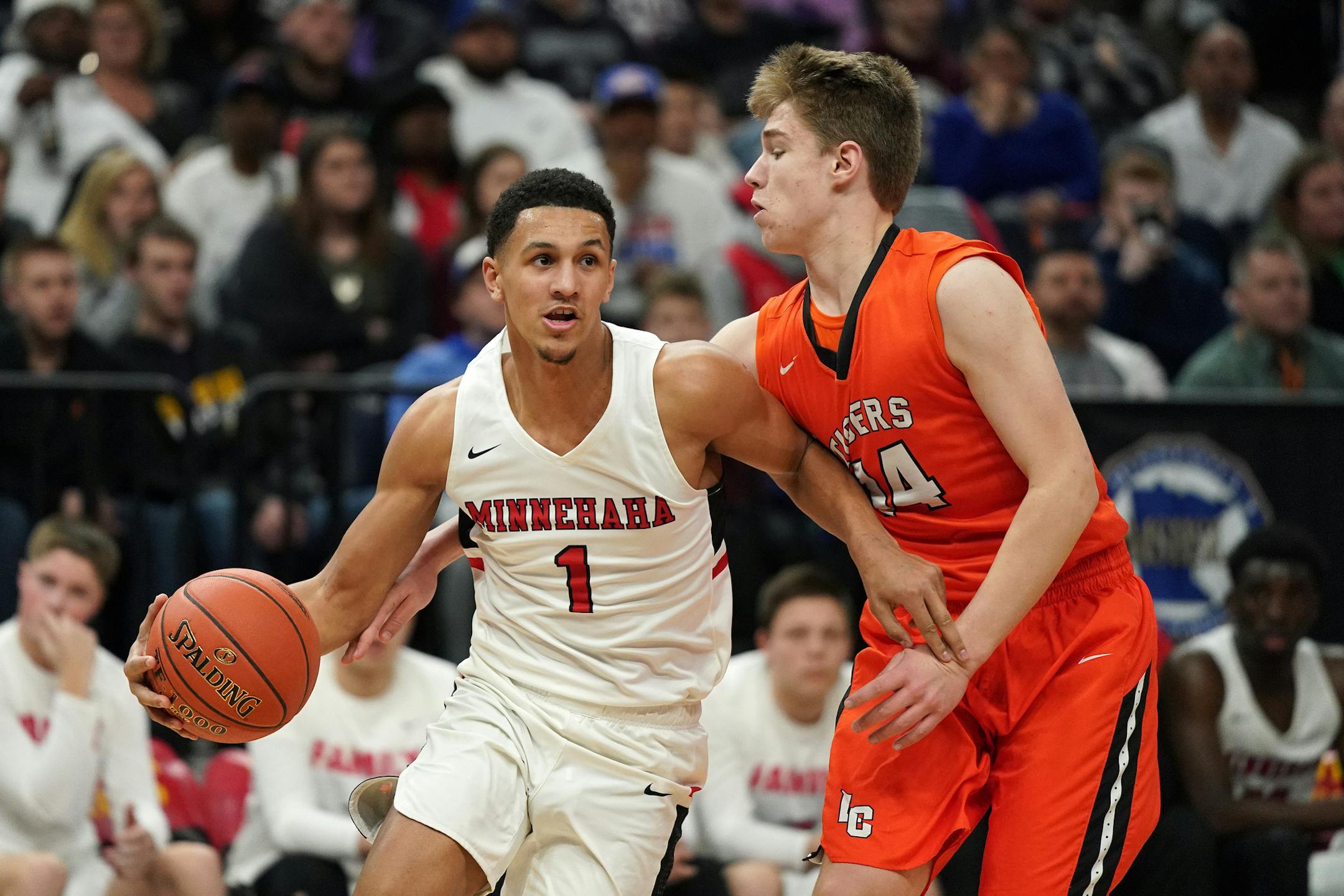 Minnehaha guard Jalen Suggs (1) drove to the basket as Lake City guard Justin Wohlers (14) tried to swat the ball away in a Class 2A state tournament game last March at Target Center. Photo: ANTHONY SOUFFLE • anthony.souffle@startribune.com