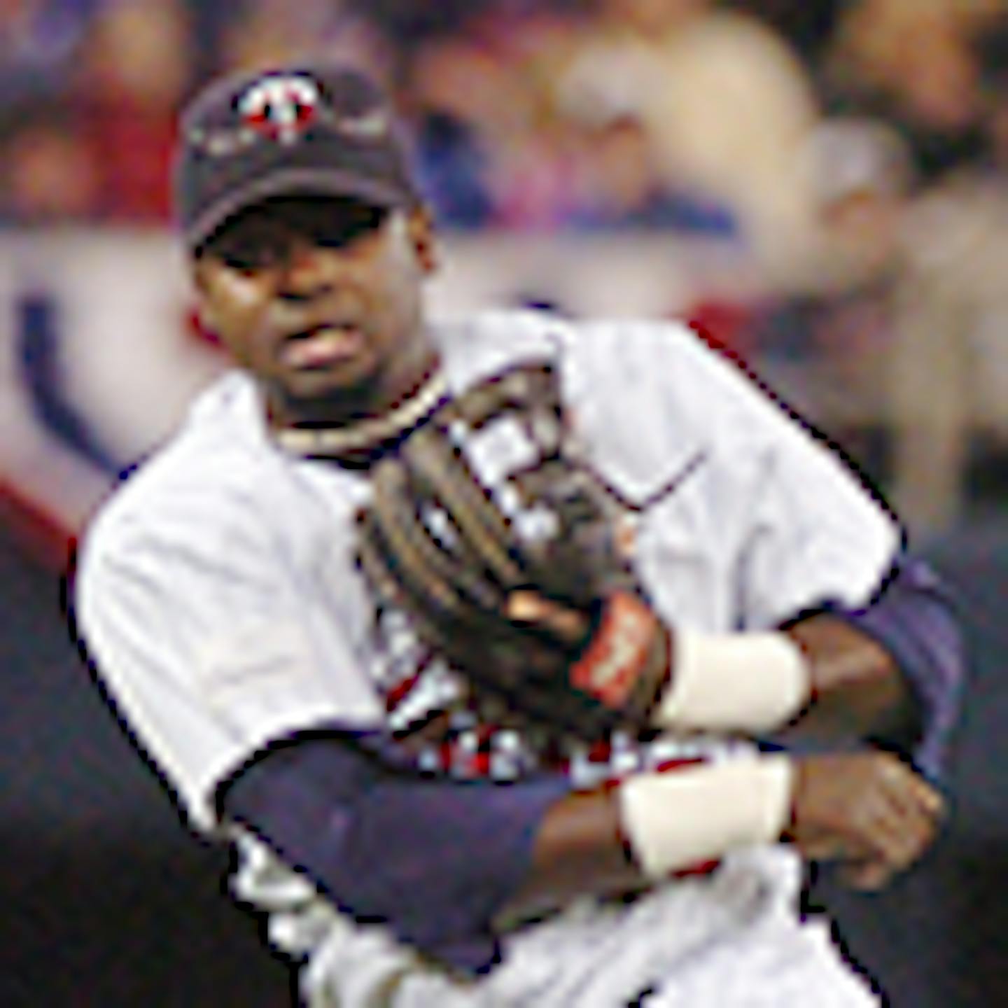 KYNDELL HARKNESS/Star Tribune Cristian Guzman throws to first after scooping up a grounder in the first inning during the Twins game against the Indians.