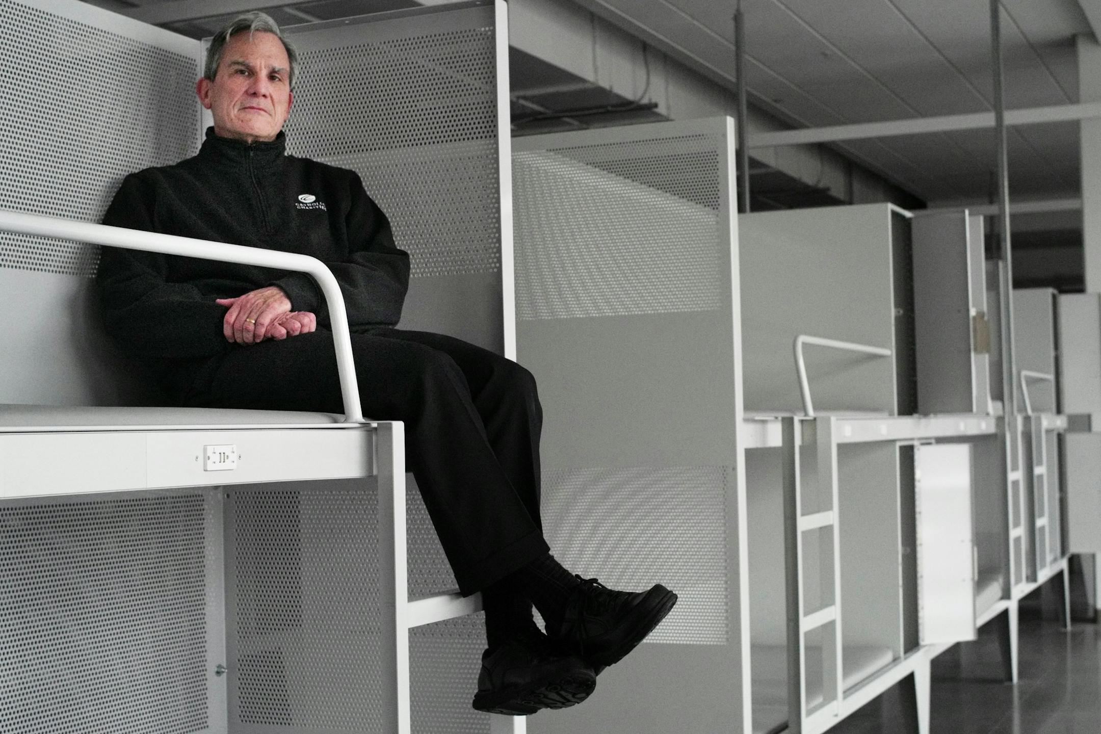 The $100 million project shepherded by Catholic Charities is the largest public-private partnership in state history. Catholic Charities CEO Tim Marx played a critical role in the deal. These overnight bunk beds have outlets for charging phones and lockers which can be secured with combination locks.