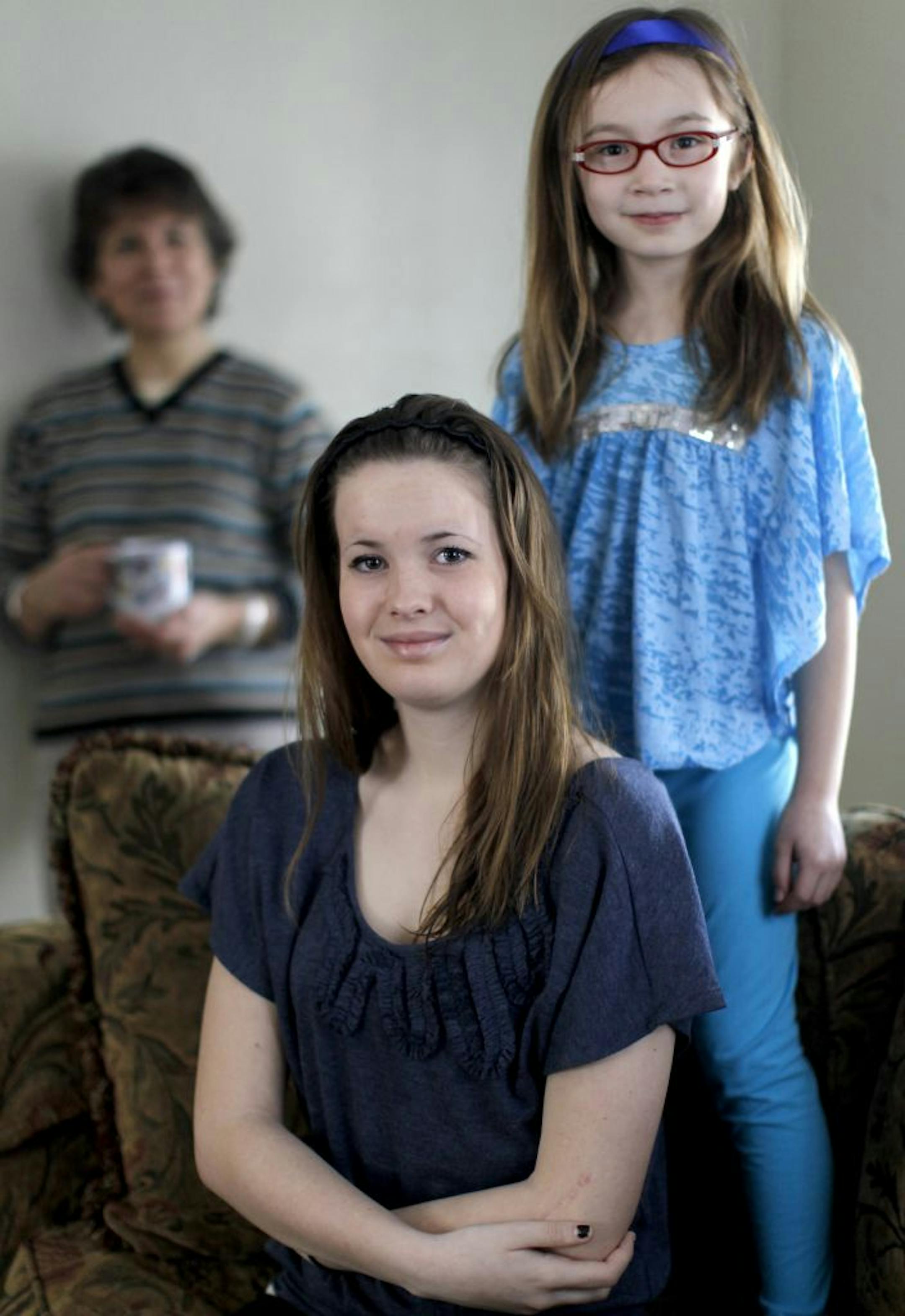 St. Paul resident Chris Szaj, left, found a baby sitter for her 7-year-old daughter, Olivia, after she met Maggie Ryan, 14, through the teen's parents.