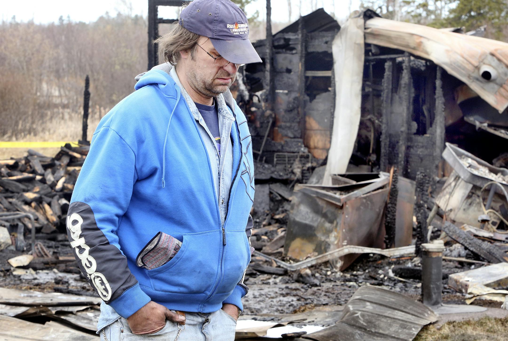 t05.11.2014 -- Steve Kuchera -- kucheraKENDALLS0512c1 -- Gordy Olson, co-owner of Russ Kendall‚Äôs Smokehouse in Knife River, walks near the business‚Äôs production area Sunday, destroyed by fire earlier in the day. The business‚Äôs store, long a fixture along scenic highway 61, suffered smoke damage. Steve Kuchera / skuchera@duluthnews.com