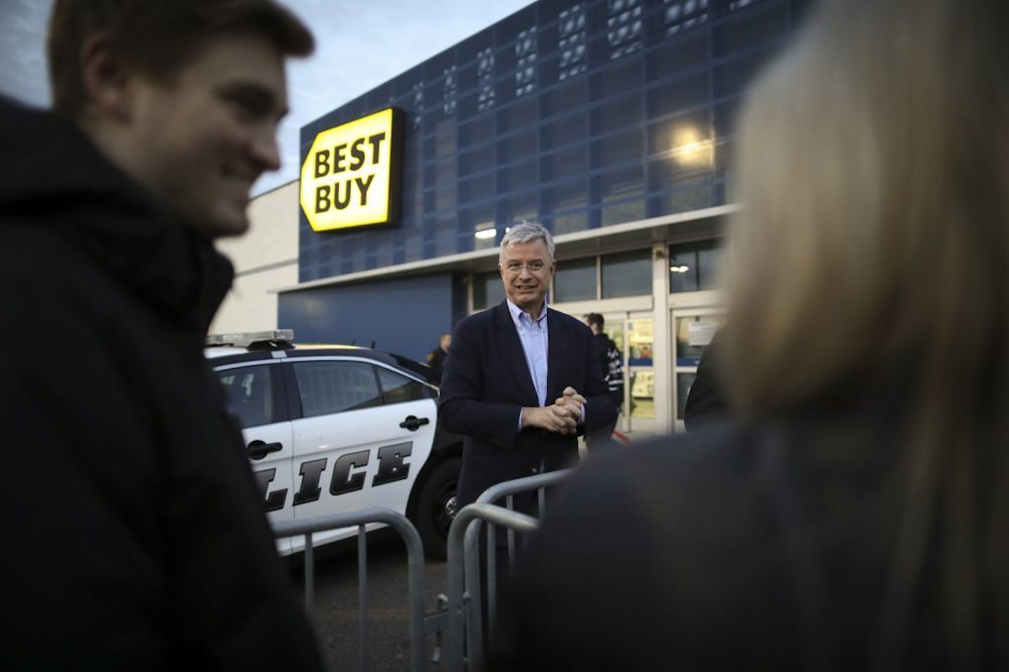 Best Buy CEO Hubert Joly talked with customers waiting in line to get into the store for early Black Friday deals Thursday evening.