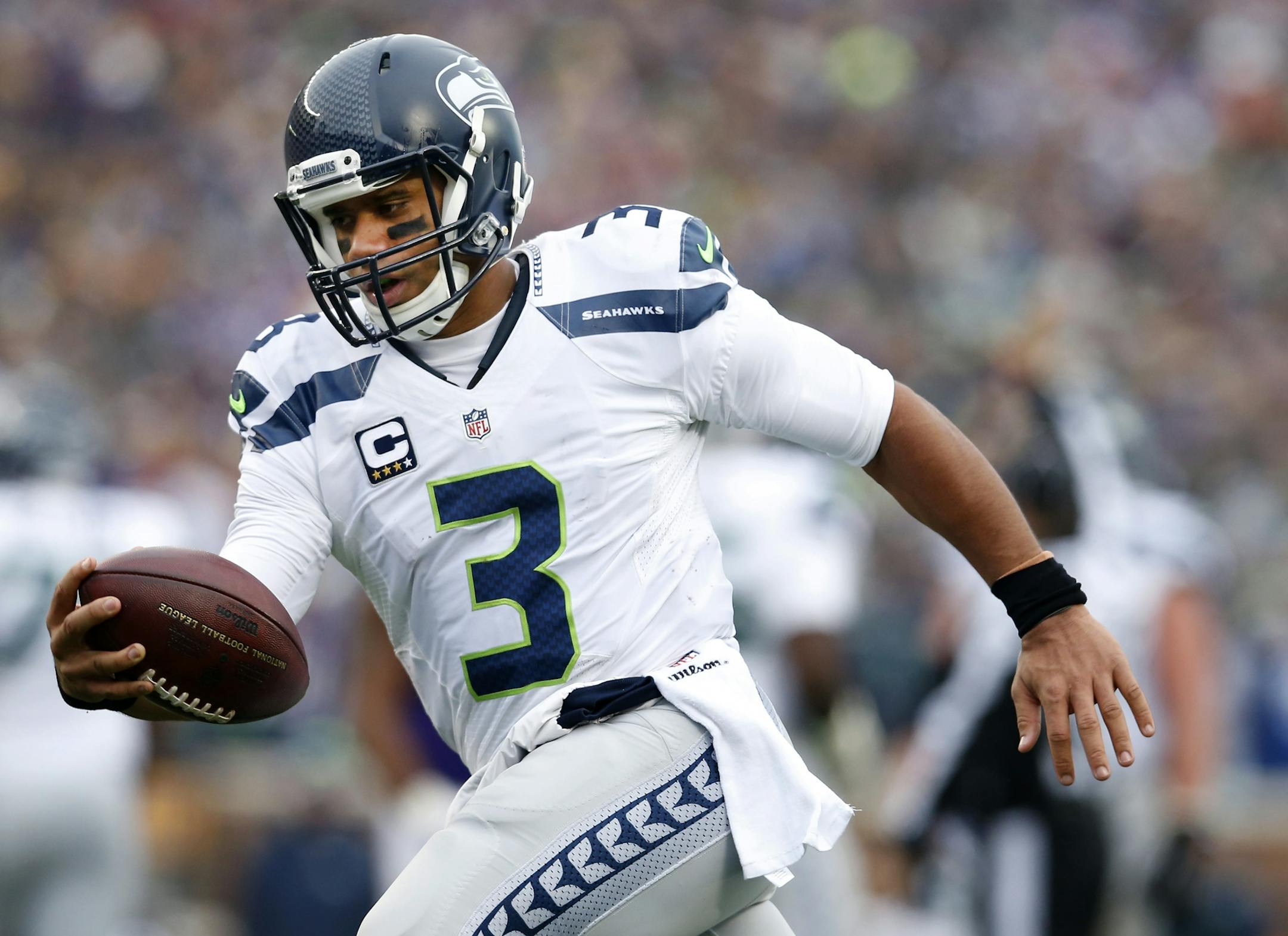 Seattle quarterback Russell Wilson (3) during a run in the second quarter.