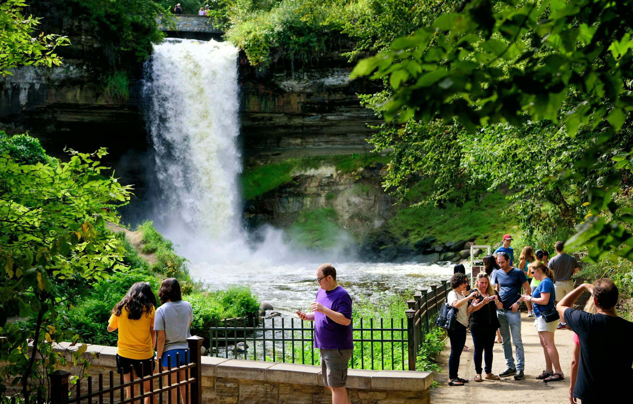 Visitors to Minnehaha Falls checked their selfies before leaving. ] GLEN STUBBE * gstubbe@startribune.com Friday, September 2, 2016 This year has shaped up to be the eighth wettest summer on record in the Twin Cities, prompting no-wake rules and high water warnings at metro lakes and rivers as boaters head out this Labor Day weekend for the final big boating weekend of the year. On Wednesday, the Minnehaha Creek Watershed District recommended no paddling on the creek because it's flowing too qui