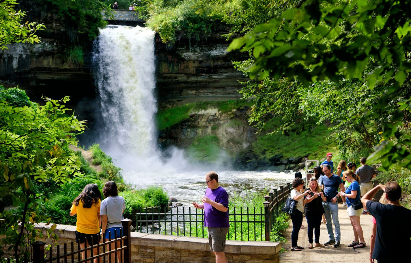 Visitors to Minnehaha Falls checked their selfies before leaving. ] GLEN STUBBE * gstubbe@startribune.com Friday, September 2, 2016 This year has shaped up to be the eighth wettest summer on record in the Twin Cities, prompting no-wake rules and high water warnings at metro lakes and rivers as boaters head out this Labor Day weekend for the final big boating weekend of the year. On Wednesday, the Minnehaha Creek Watershed District recommended no paddling on the creek because it's flowing too qui