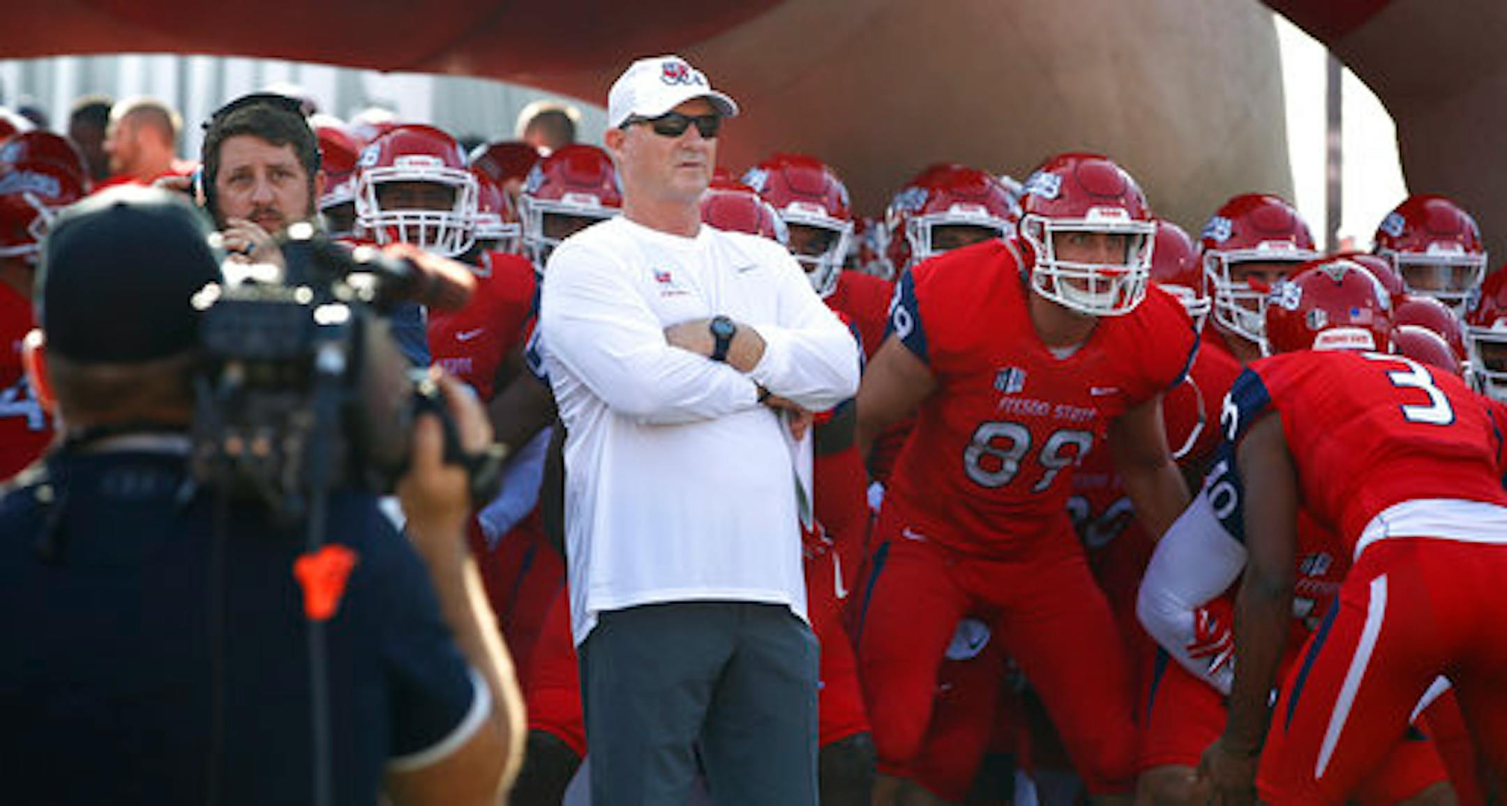 Fresno State coach Jeff Tedford waits with his team to head into the stadium to take on Boise State during the first half of an NCAA college football game in Fresno, Calif., Saturday, Nov. 25, 2017. (AP Photo/Gary Kazanjian)