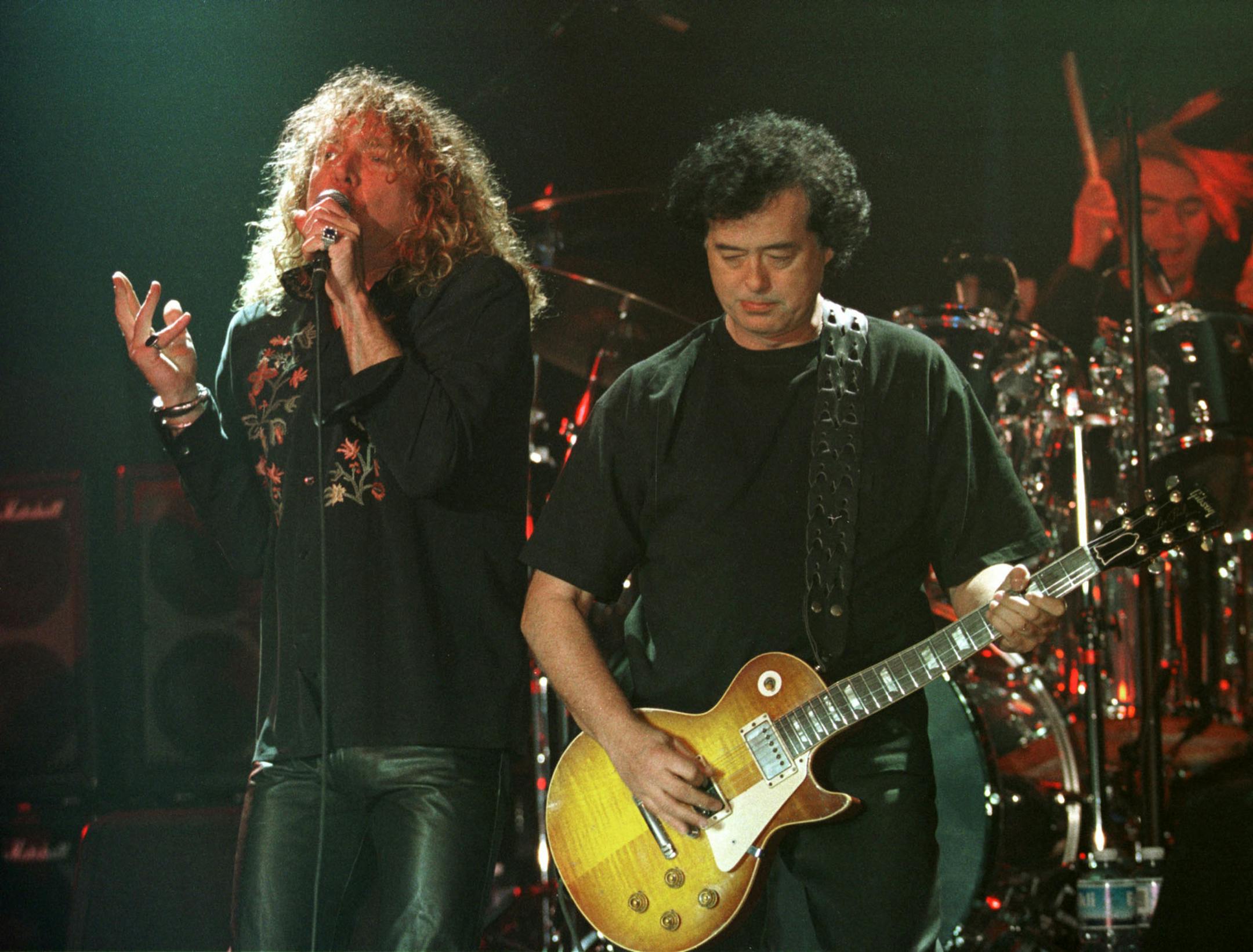 FILE - In this in this March 5, 1998, file photo, Led Zeppelin's Robert Plant, left, performs with guitarist Jimmy Page during their concert in Istanbul. Jimmy Page and Robert Plant, Madonna, and John Mellencamp are among the nominees for the 2014 Songwriters Hall of Fame. They're joined by a number of top acts, including Ray Davies, Sade, Cyndi Lauper and Linda Perry. Songwriters Hall gave The Associated Press a list of nominees in advance of the official announcement, set for Thursday, Oct. 9,
