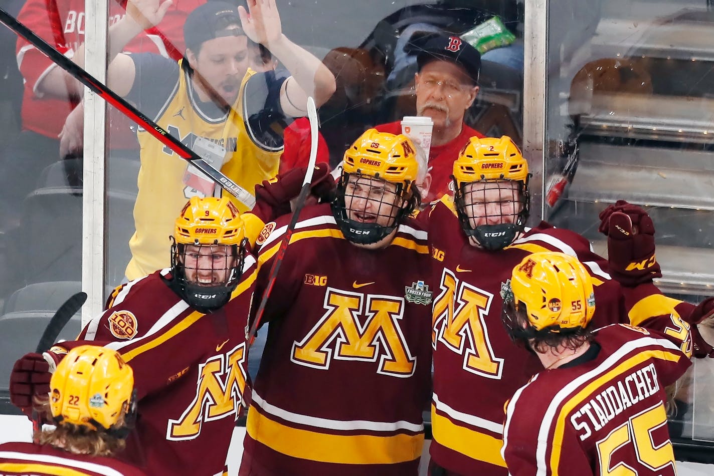 Minnesota's Matthew Knies, center rear, celebrates his goal with teammates during the first period of an NCAA men's Frozen Four college hockey semifinal against Minnesota State, Thursday, April 7, 2022, in Boston. (AP Photo/Michael Dwyer)