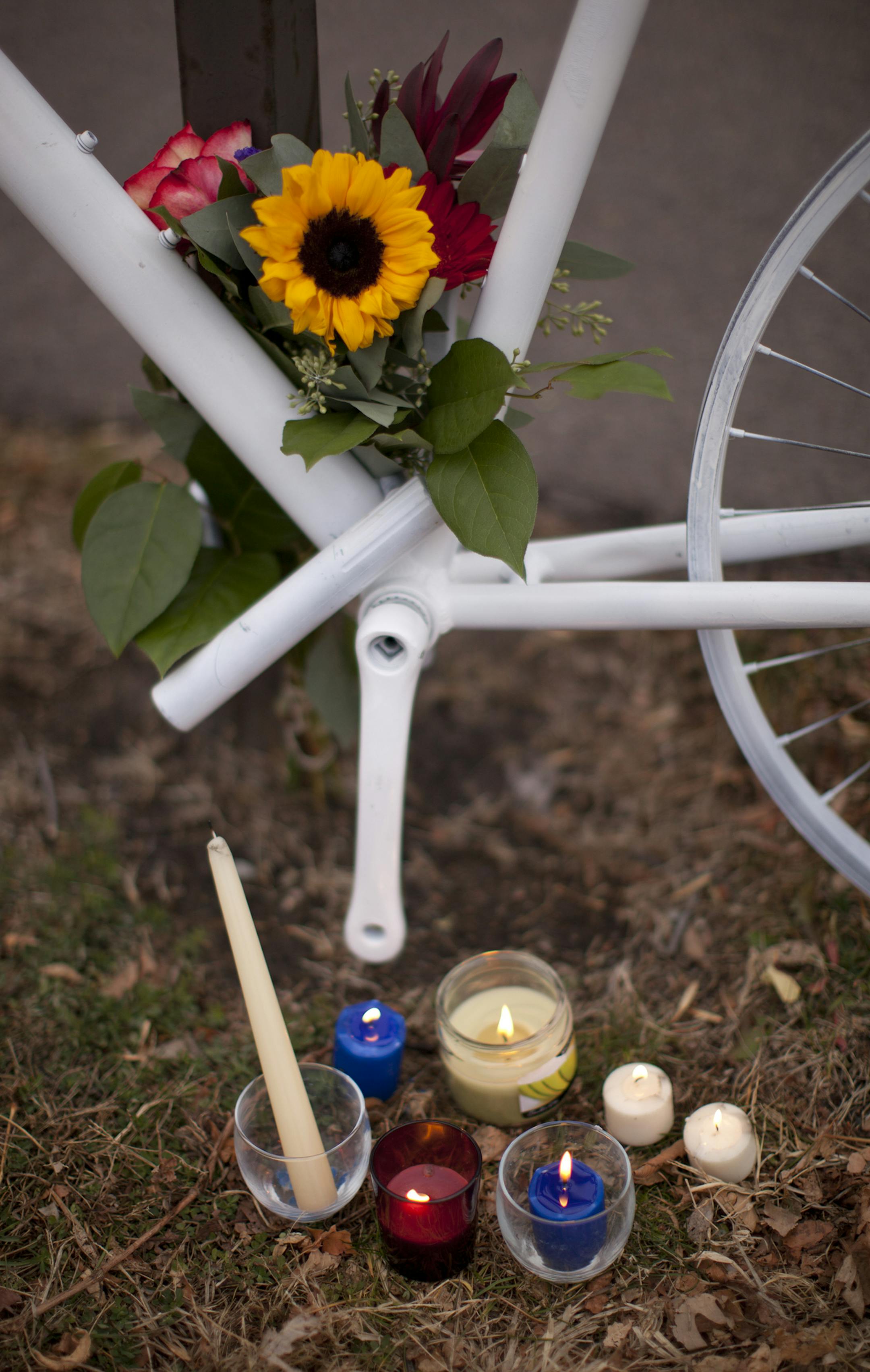 Candles sat next to the white "ghost bike" at the spot where Tim Malloy was struck by a hit-and-run driver on W. River Rd in Minneapolis, just south of Franklin Ave. A memorial was held by family and friends on Sunday afternoon, November 27, 2011 at the scene of the accident that killed bicyclist Tim Malloy earlier this month. ] JEFF WHEELER ‚Ä¢ jeff.wheeler@startribune.com