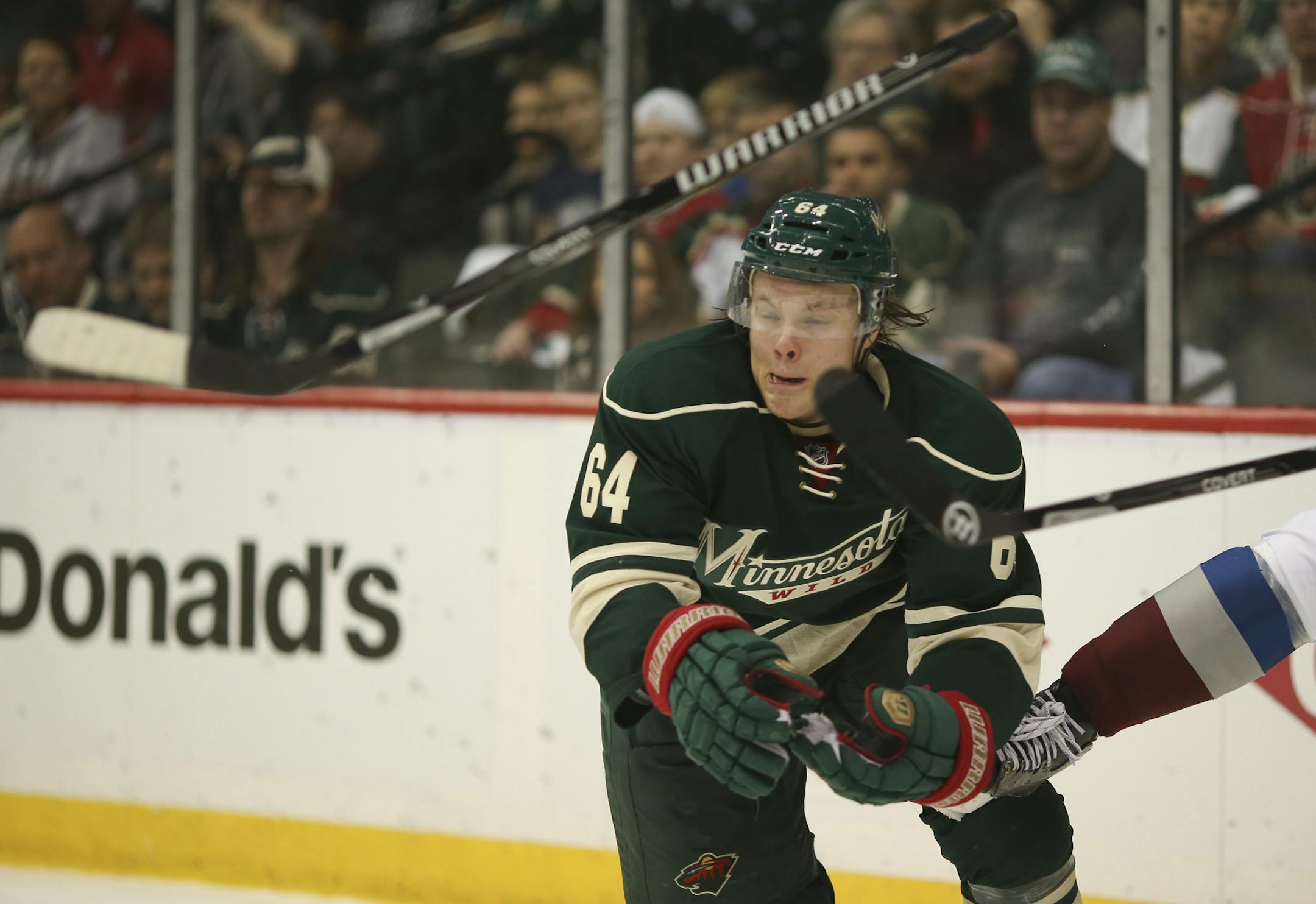 Minnesota Wild center Mikael Granlund (64) had his stick kicked away by Colorado Avalanche defenseman Nick Holden (2) in the corner in the third period Thursday night at Xcel Energy Center. ] JEFF WHEELER ‚Ä¢ jeff.wheeler@startribune.com The Minnesota Wild beat the Colorado Avalanche 2-1 in game 4 of their first round playoff series Thursday night, April 24, 2014 at Xcel Energy Center in St. Paul.
