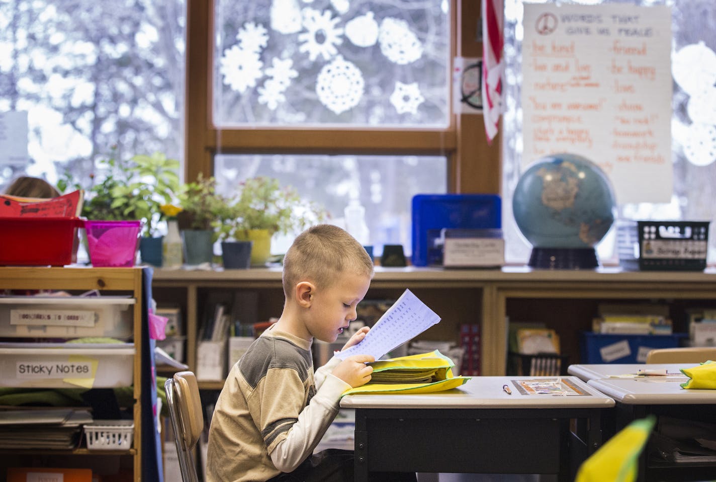 Second grader Drew Leonard reads vocabulary words during a reading workshop at Marine Elementary School in Marine on St. Croix on Friday, January 15, 2016. ] (Leila Navidi/Star Tribune) leila.navidi@startribune.com BACKGROUND INFORMATION: A storm of community protest has greeted a Stillwater school district plan to close three elementary schools.