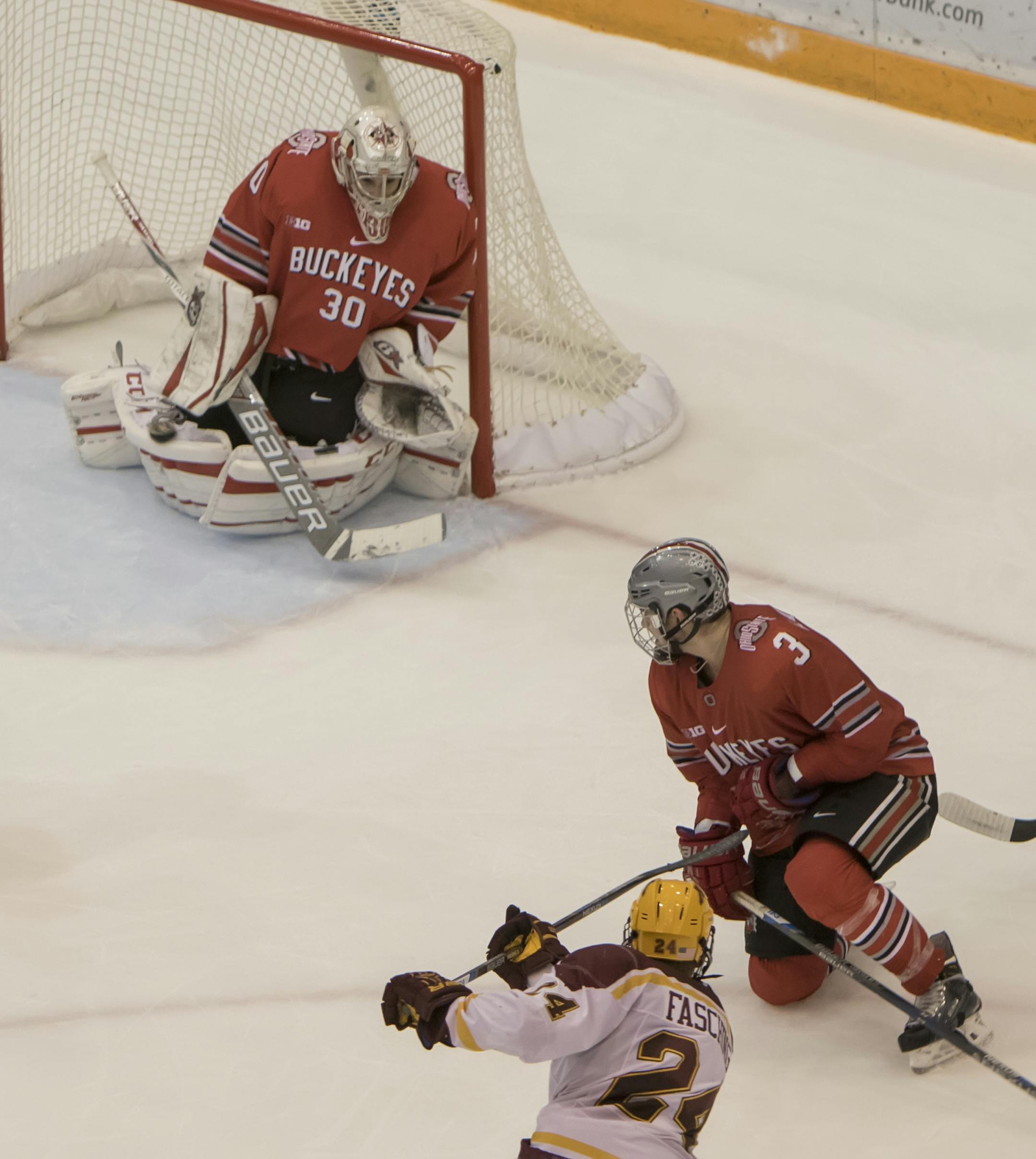 Minnesota Golden Gophers forward Hudson Fasching (24) scores the game winning overtime goal as the puck goes in the far side of the goal past Ohio State Buckeyes goalie Christian Frey (30) as the Minnesota Golden Gophers hosted the Ohio State Buckeyes to open the Big Ten Conference schedule on December 4, 2015. ] Special to Star Tribune MATT BLEWETT &#xef; matt@mattebphoto.com - December 4, 2015, Minneapolis, MN, Big Ten Hockey, Minnesota Golden Gophers vs. Ohio State Buckeyes, 257622 UPUK 12041