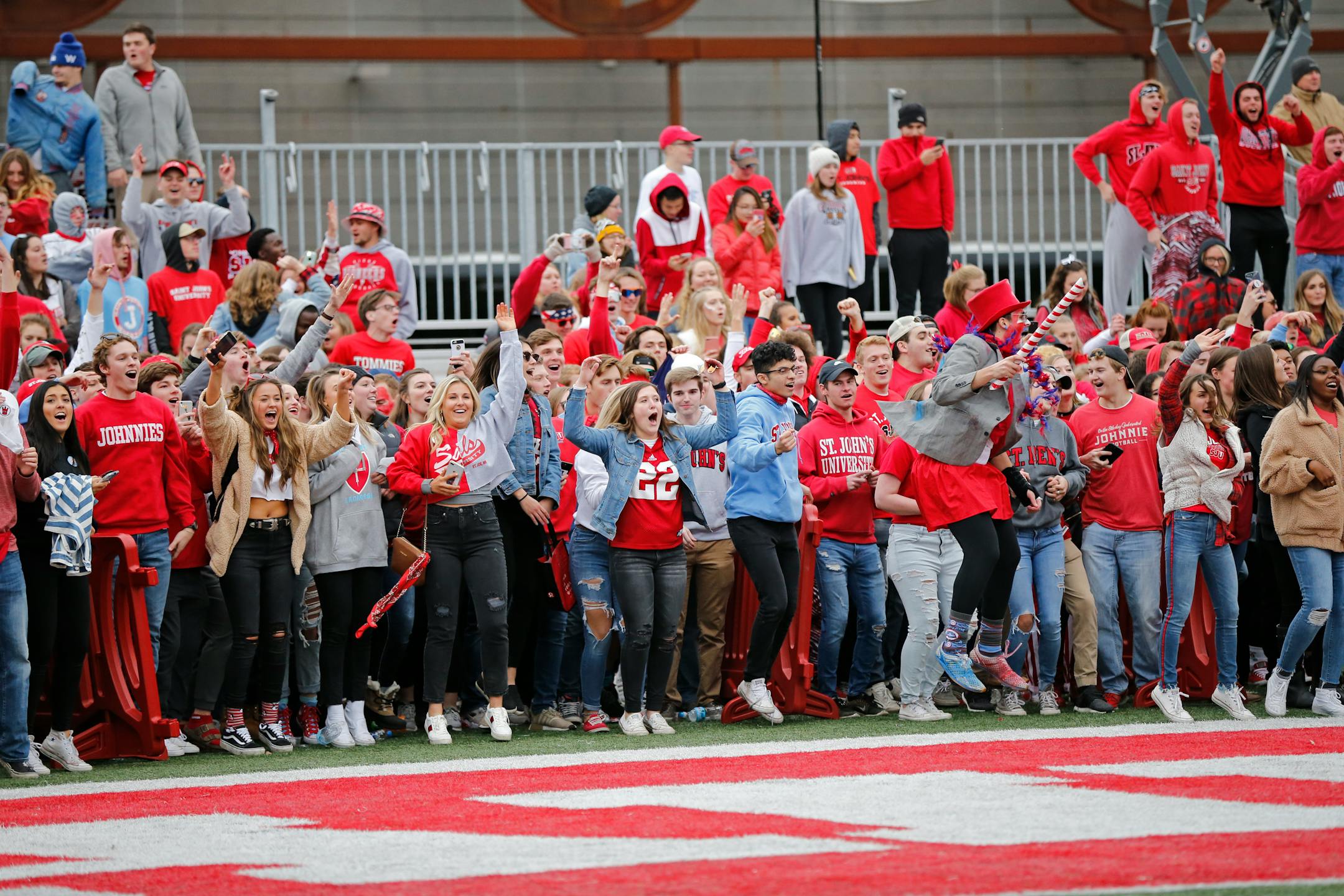 St. John's fans waited for the game clock to run out before rushing onto the field after the Johnnies topped the Tommies 40-20 last fall. The football rivalry will go away for good in 2020.