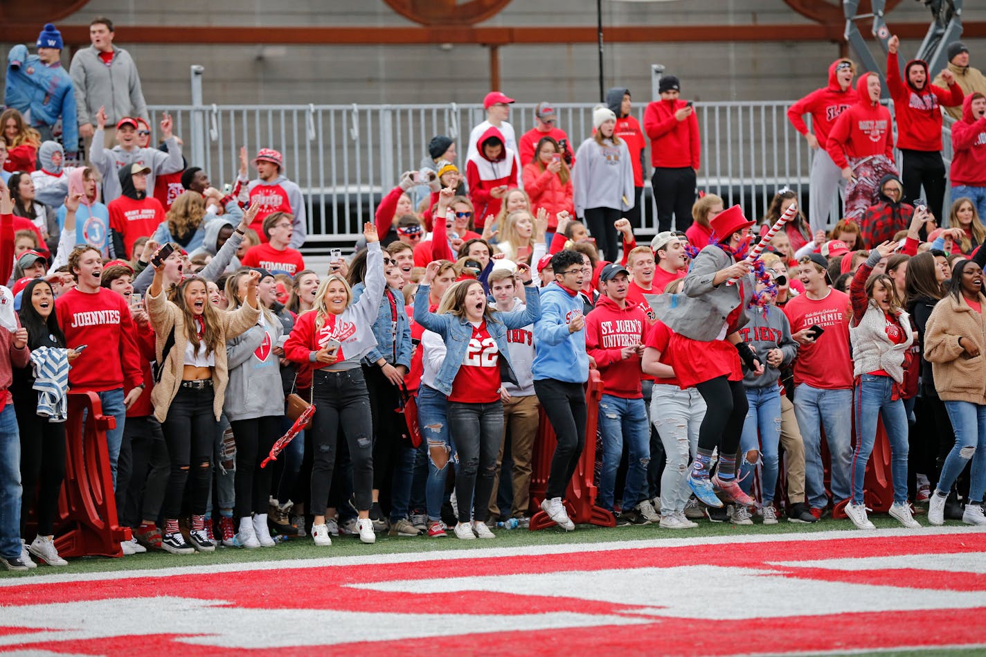 St. John's fans waited for the game clock to run out before rushing onto the field after the Johnnies topped the Tommies 40-20 last fall. The football rivalry will go away for good in 2020.