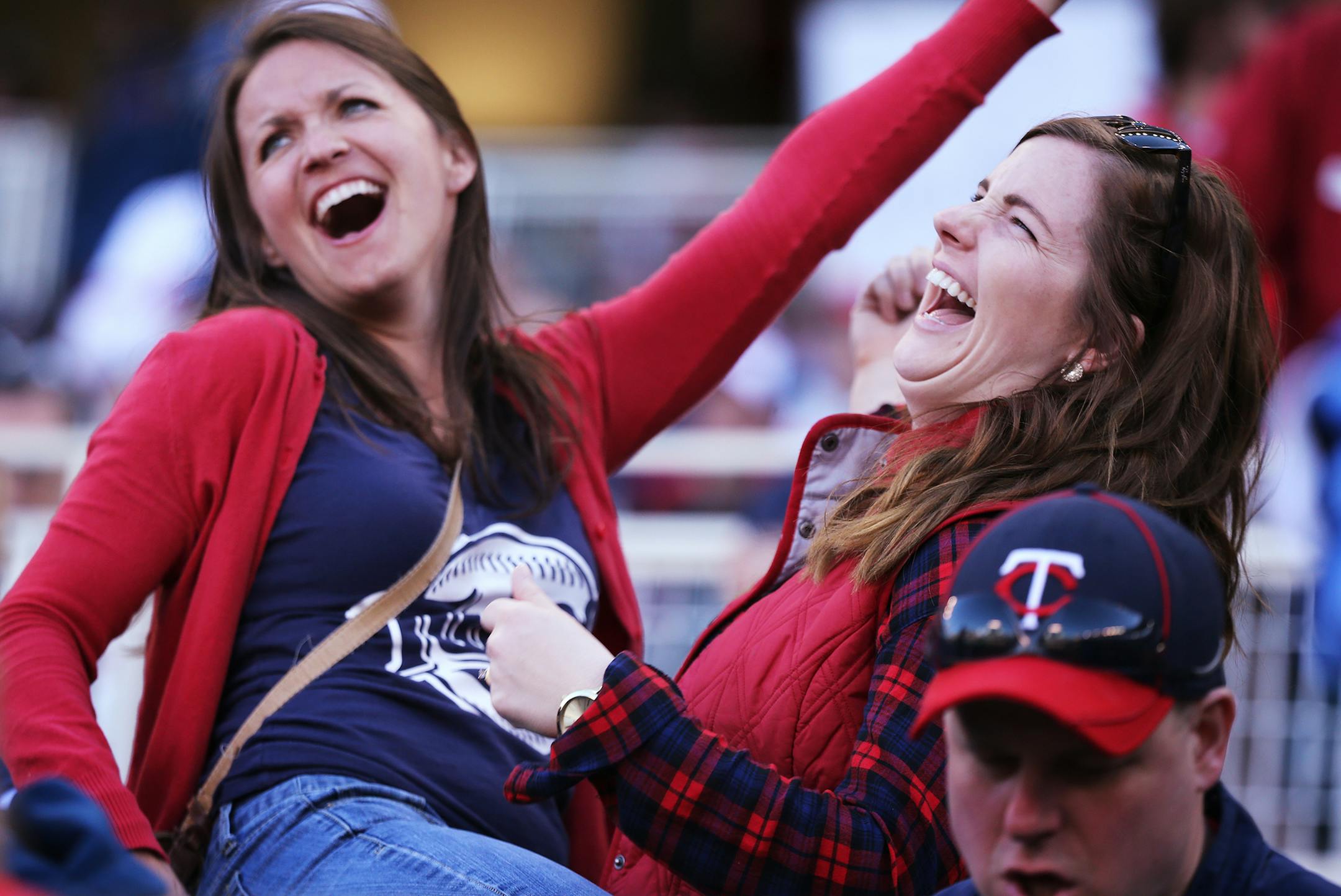 Fans Audrey Heidorn, left, and Michaela Mueller dance during the Twins home opener against the Kansas City Royals at Target Field in Minneapolis on Monday, April 13, 2015. ] LEILA NAVIDI leila.navidi@startribune.com /