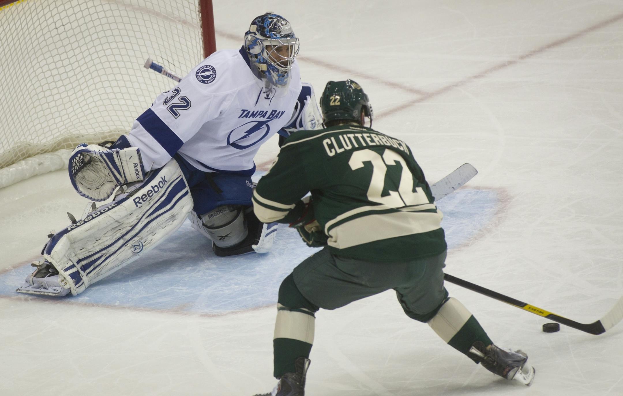 Tampa Bay Lightning goalie Mathieu Garon faced up against Minnesota's Cal Clutterbuck Nov. 28, 2011.