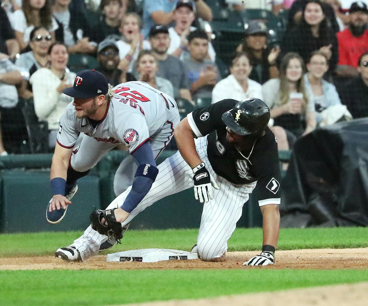 Jose Abreu reaches third base on a triple as Twins third baseman Josh Donaldson defends the bag in the third inning Tuesday