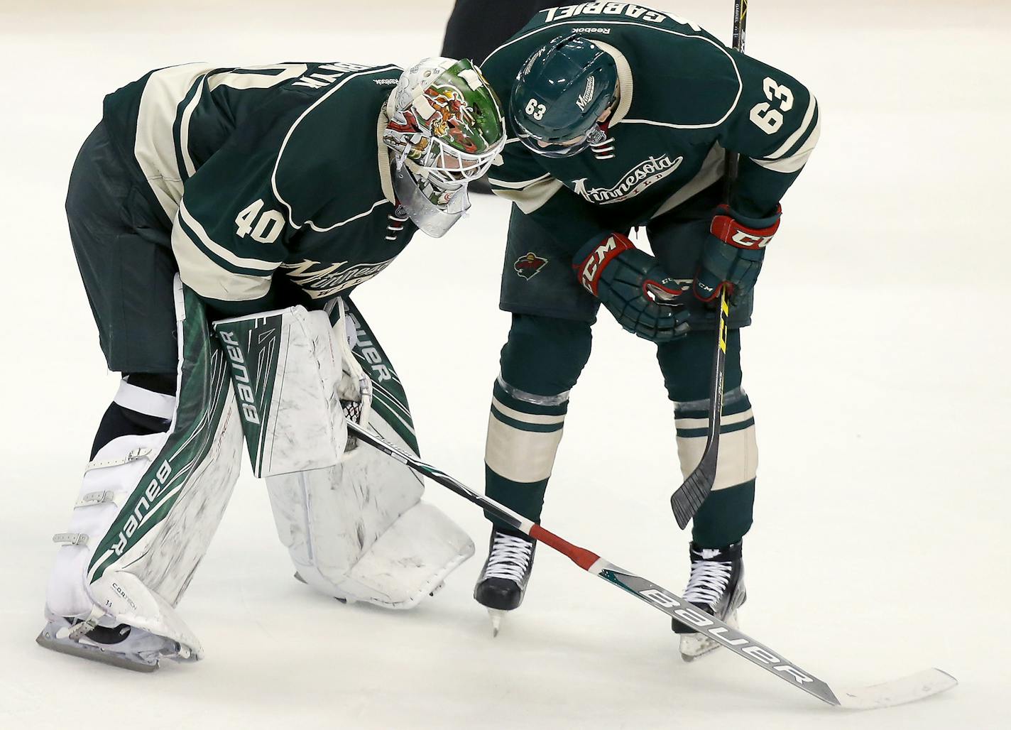 Kurtis Gabriel (63) spoke with Wild goalie Devan Dubnyk (40) at the end of the season-ending loss to Dallas.