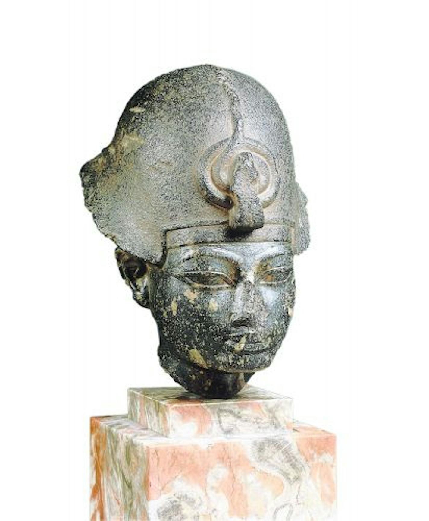 Head of the Pharaoh Amenhotep III wearing the Khepresh, ca. 1400 BCE.