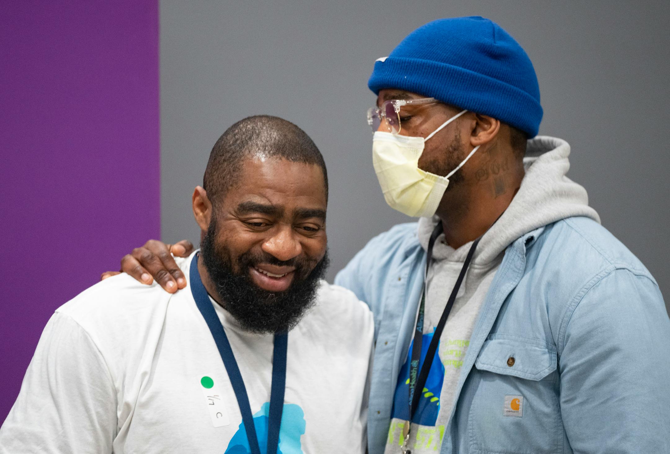 Vinson Jones, a stabbing survivor and Next Step Client, is embraced by Quincy Jones, a case manager with Next Step, left to right, at a press conference regarding the Next Step Program Tuesday, Jan. 17, 2023 at Hennepin County Medical Center in Minneapolis ]