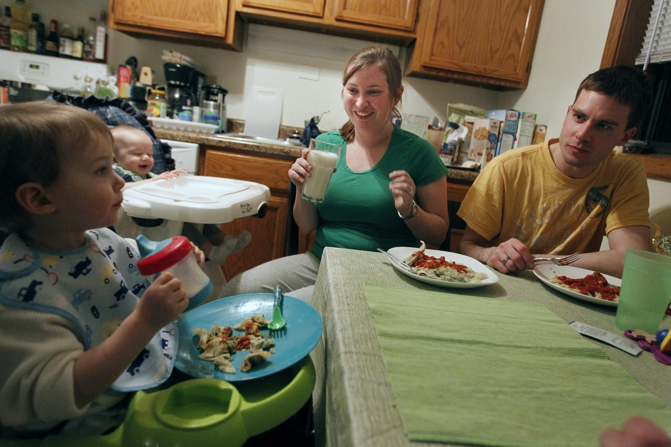 Better times: Two-year-old Teagan and his brother Paxton, 8 months, sat down to dinner with their parents, Millie Eidsvaag and Randy Goodermont. After several lean years, Eidsvaag recently became a permanent hire at the Jewish Community Center.