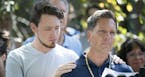 Don Damond is comforted by his son Zach Damond as he made a statement to the press near his home after Minneapolis police officer shot and killed his 