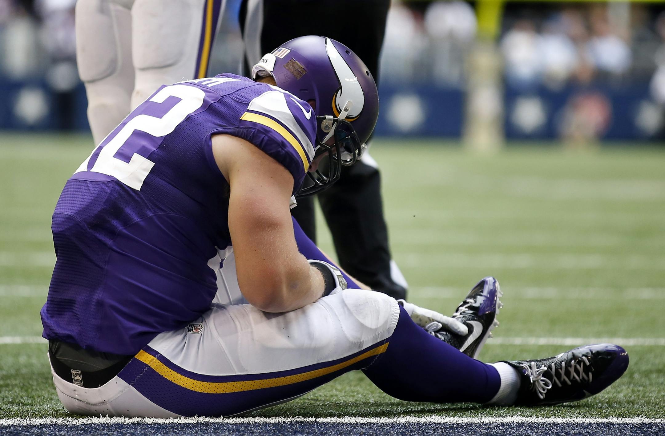 Minnesota Vikings Kyle Rudolph held his foot after scoring a touchdown in the third quarter.