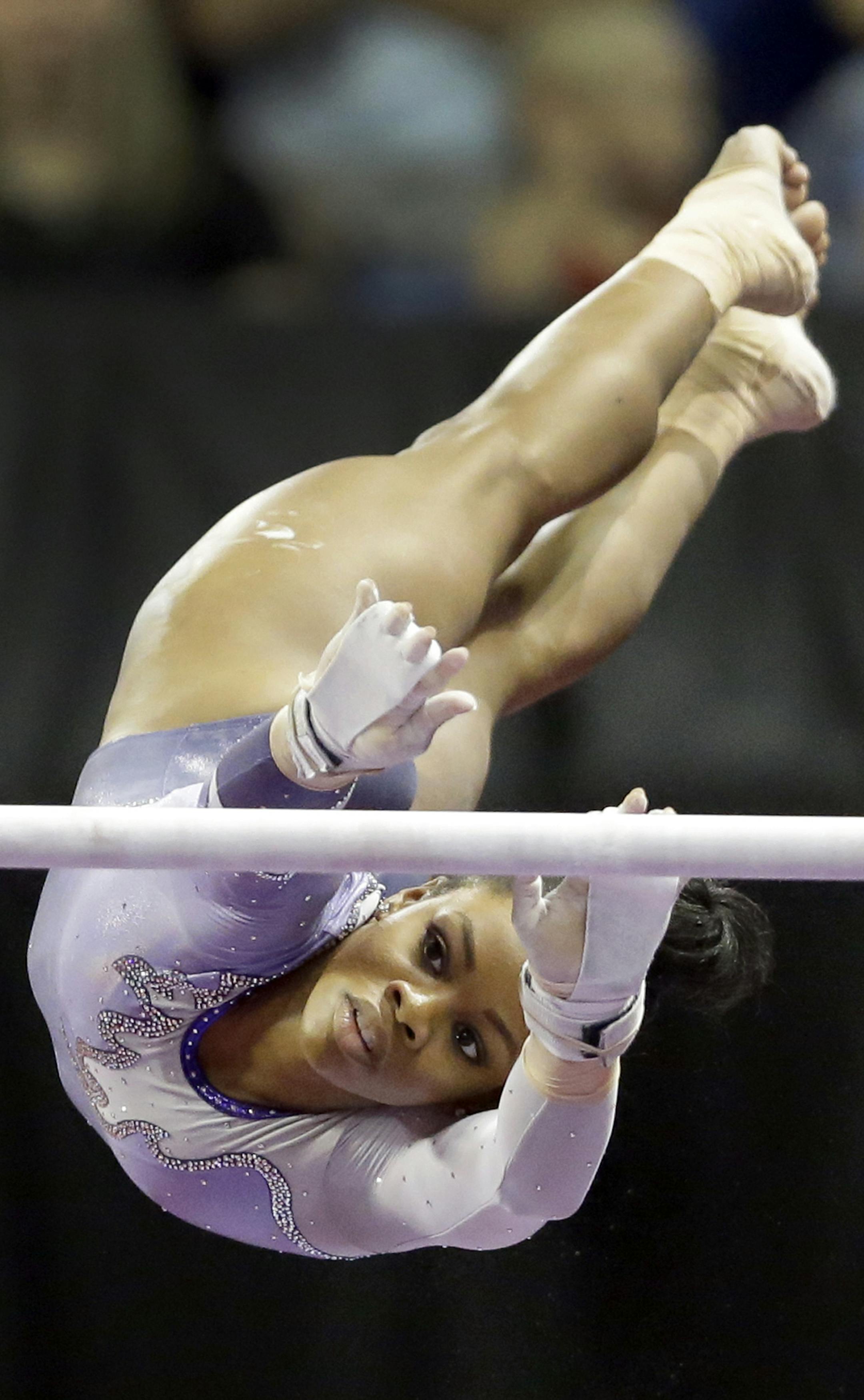Gabby Douglas competes on the uneven bars during the U.S. women's gymnastics championships Sunday, June 26, 2016, in St. Louis. (AP Photo/Jeff Roberson) ORG XMIT: MOJR114