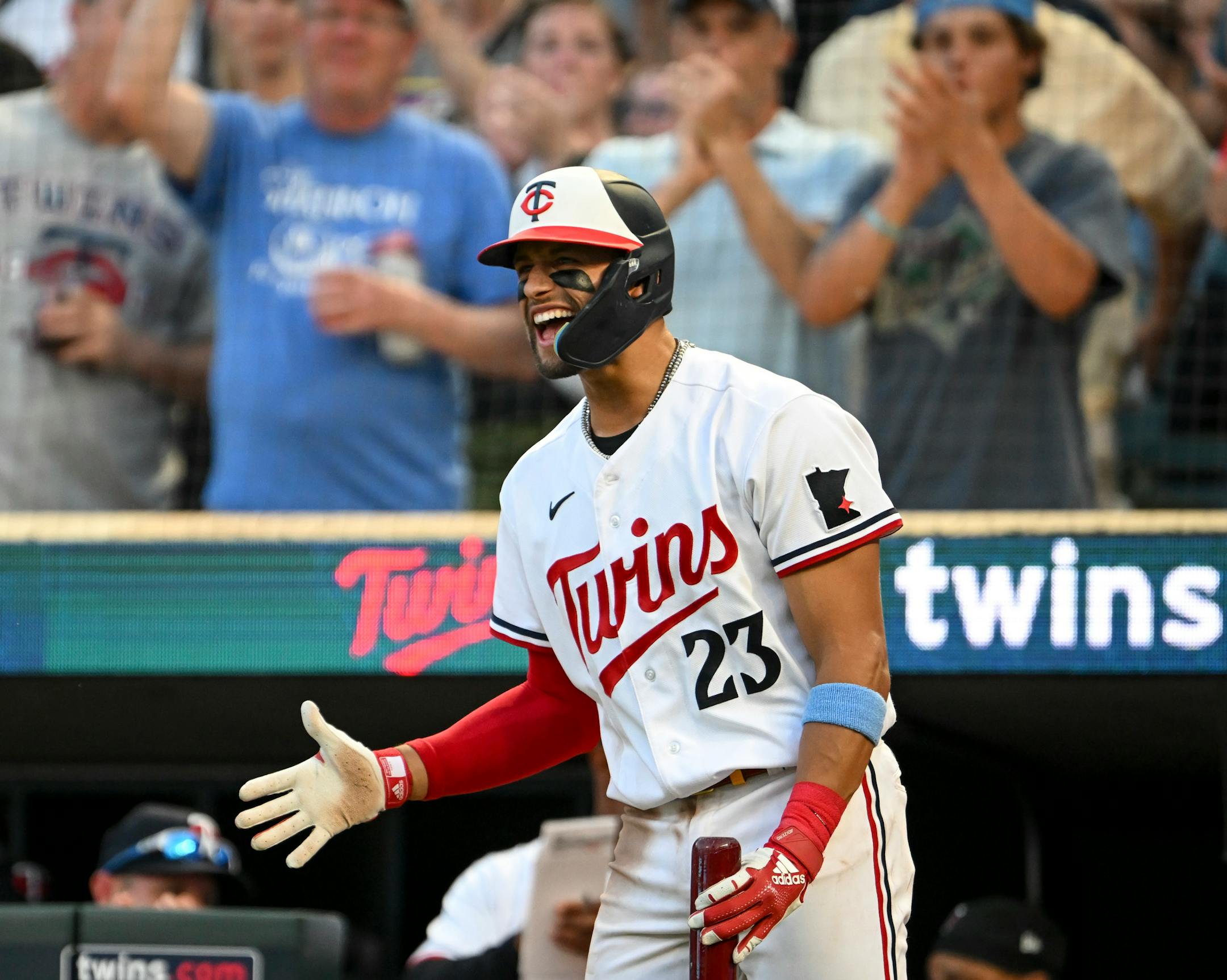 Minnesota Twins third baseman Royce Lewis (23) celebrates with right fielder Max Kepler (26) after Kepler hit a solo home run in the bottom of the sixth inning against the Boston Red Sox Wednesday, June 21, 2023, at Target Field in Minneapolis, Minn.