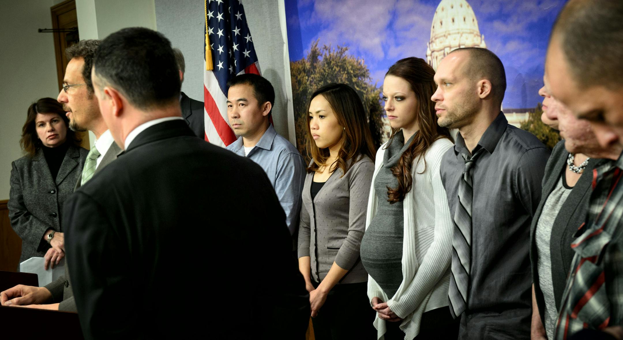 Koua Fong Lee and Michael Hanson listened as Sen Ron Latz and Rep. John Lesch announced a bill that would compensate people who were wrongly convicted and imprisoned for crimes they did not commit and were later exonerated. Both these men spent years in jail and were later exonerated. Tuesday morning, January 28, 2014 ] GLEN STUBBE * gstubbe@startribune.com EDS. center is Koua Fong Lee's wife Pang Houa Moua and Hansen's girl friend Shaylee Gutowski
