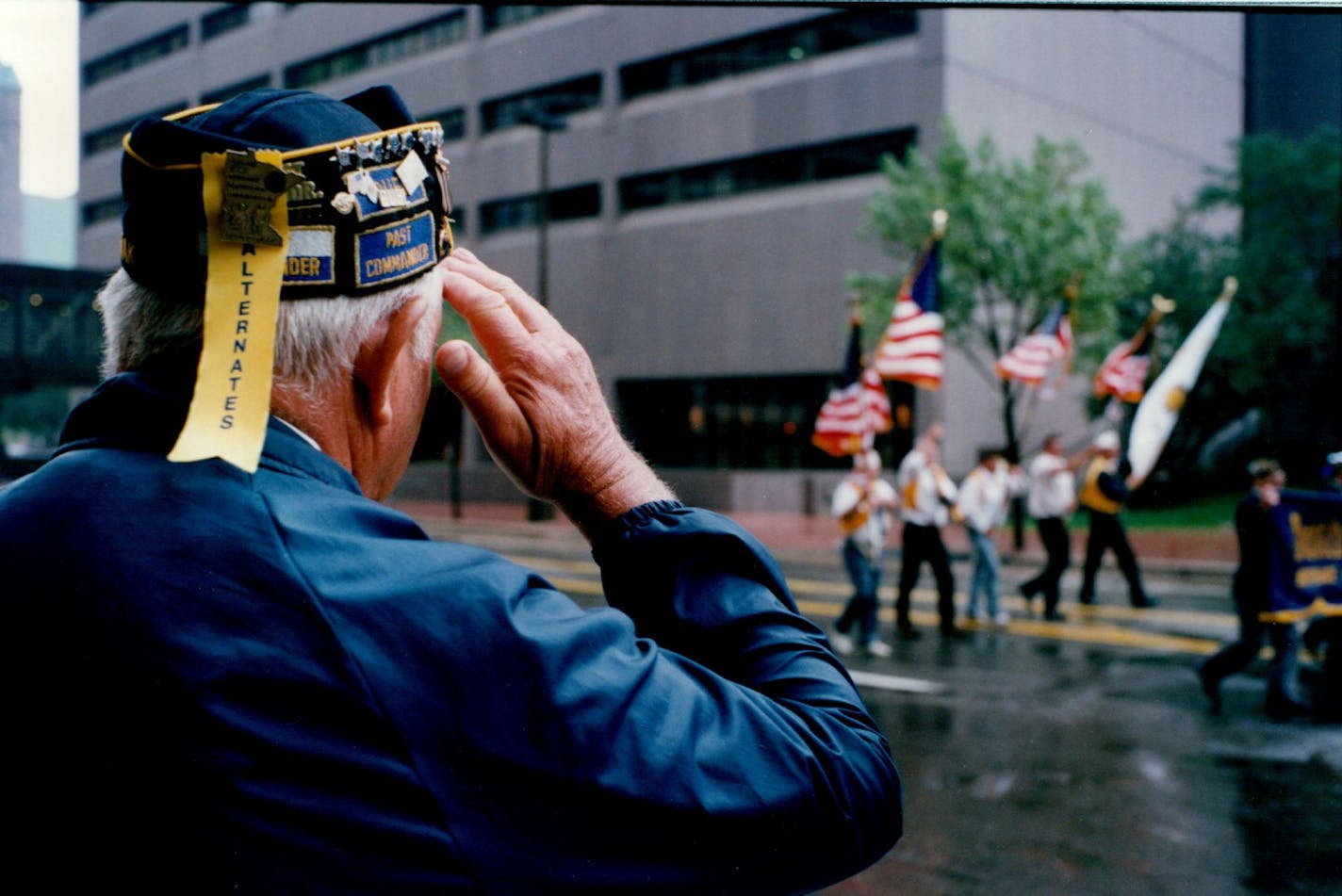 September 4, 1994 The 76th annual American National Convention is meeting at the Minneapolis Convention Center through Thursday. Sunday afternoon they paraded through the rain falling on downtown Minneapolis. A Legionnaire salutes the color guard passing him dur&#xac;&#x2260;ing the parade. September 5, 1994 Jeff Wheeler, Minneapolis Star Tribune