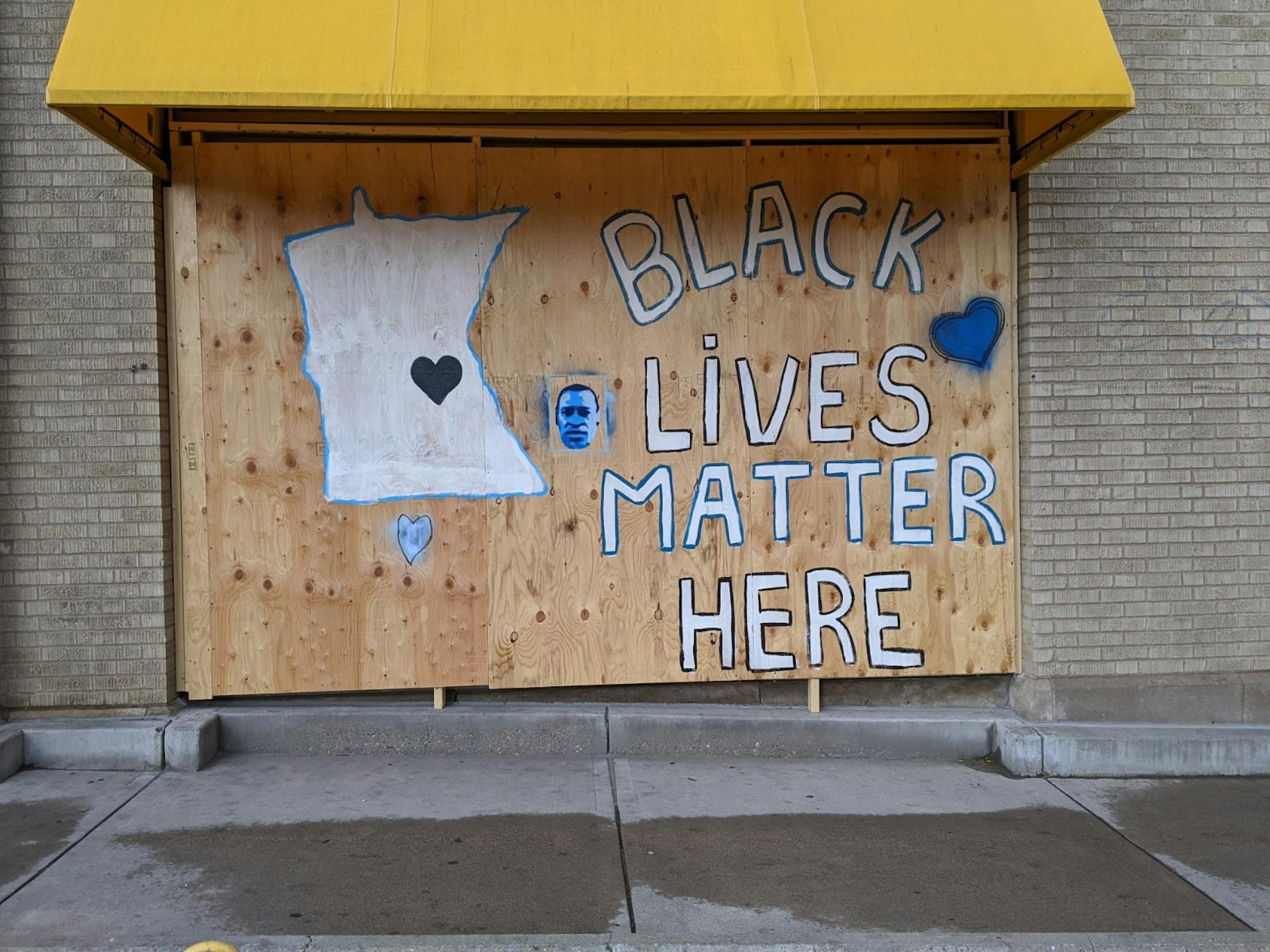 Murals on the boarded-up windows of the Midtown Global Market at 920 E Lake St.. in Minneapolis offer messages of solidarity for Black Lives Matter in Minnesota.
