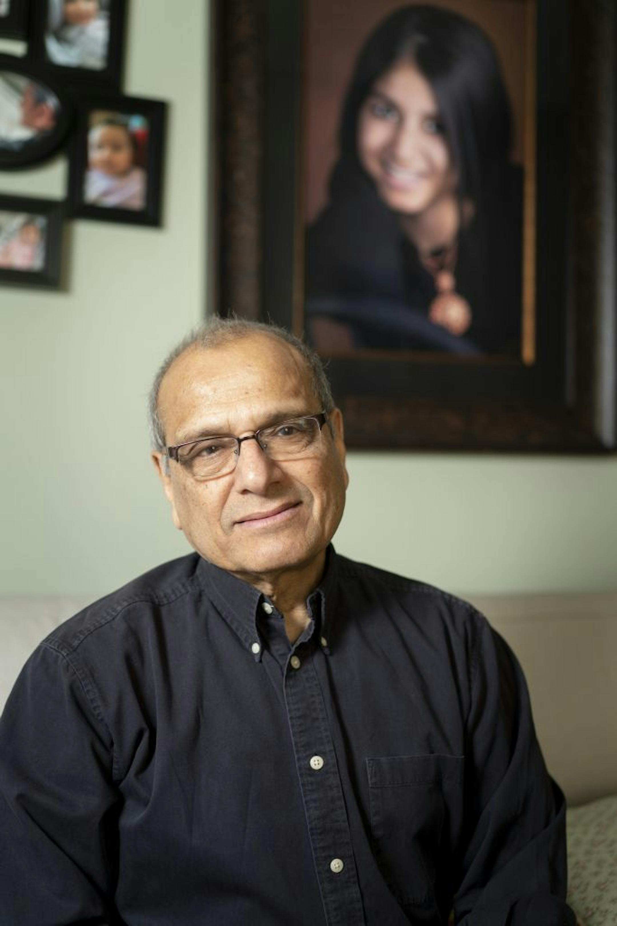 Vijay Dixit's 19-year-old daughter Shreya Dixit was killed about a decade ago when the driver of the car in which she was riding was involved in a distracted driver crash. He was photographed in front of her senior portrait in Eden Prairie, Minn., on March 22, 2019.